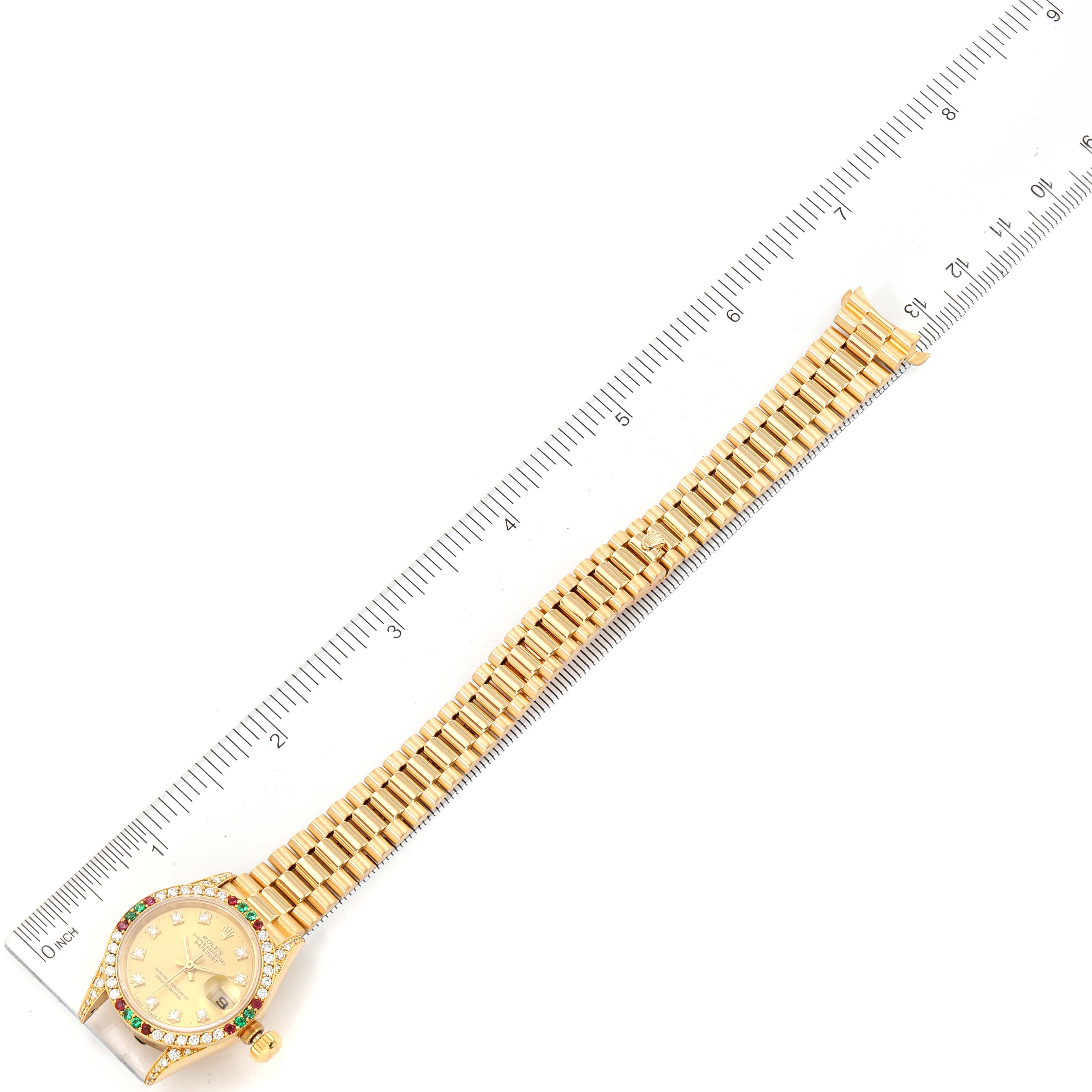 The image shows the Rolex President 69038 Women's Yellow Gold Champagne Dial 69038 Women's Yellow Gold Champagne Dial model watch laid flat with a ruler measuring its length.