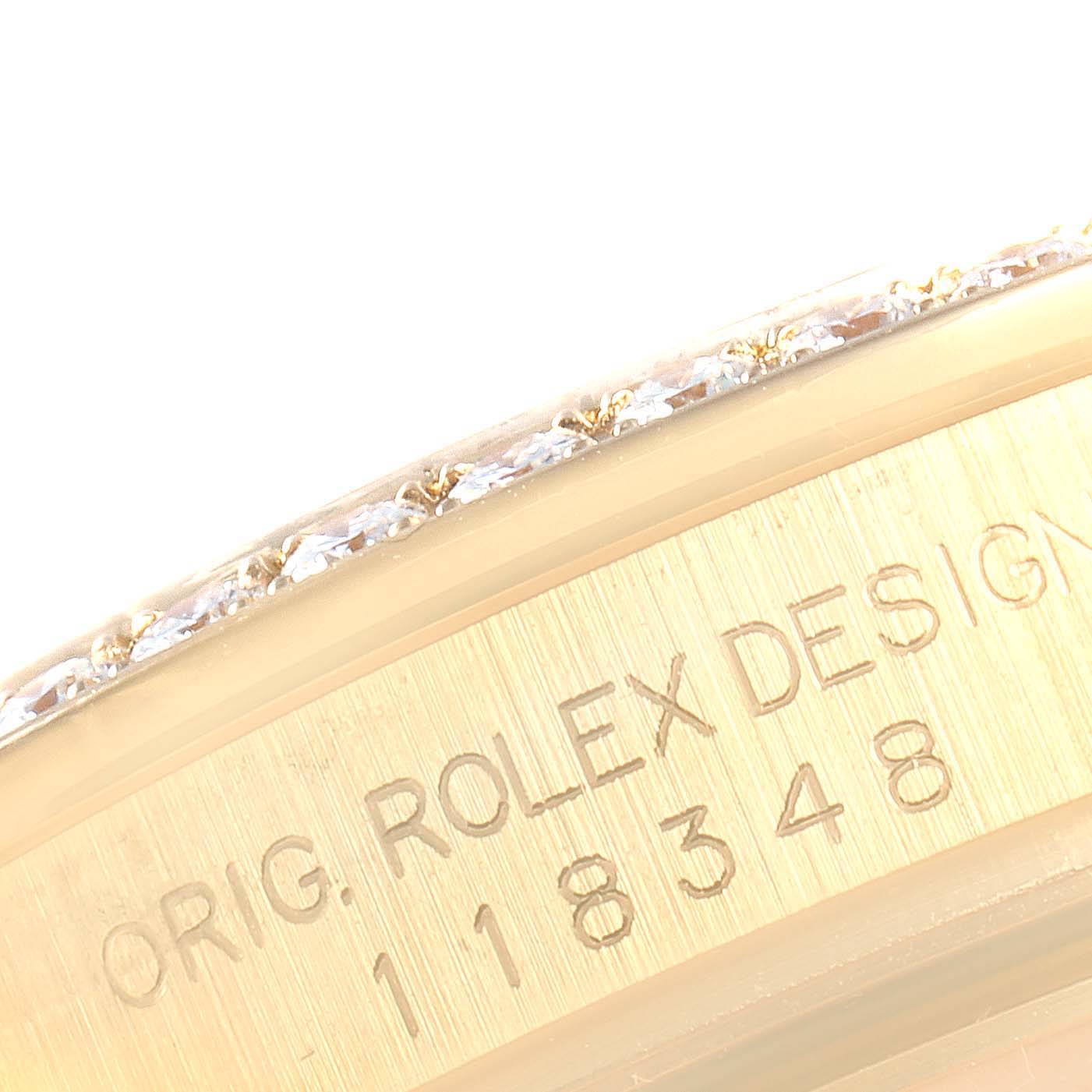 This image shows a close-up of the edge of the case and bezel of a Rolex President 118348 Men
s Yellow Gold Mother of Pearl Dial 118348 Men
s Yellow Gold Mother of Pearl Dial model, highlighting the serial and model number.