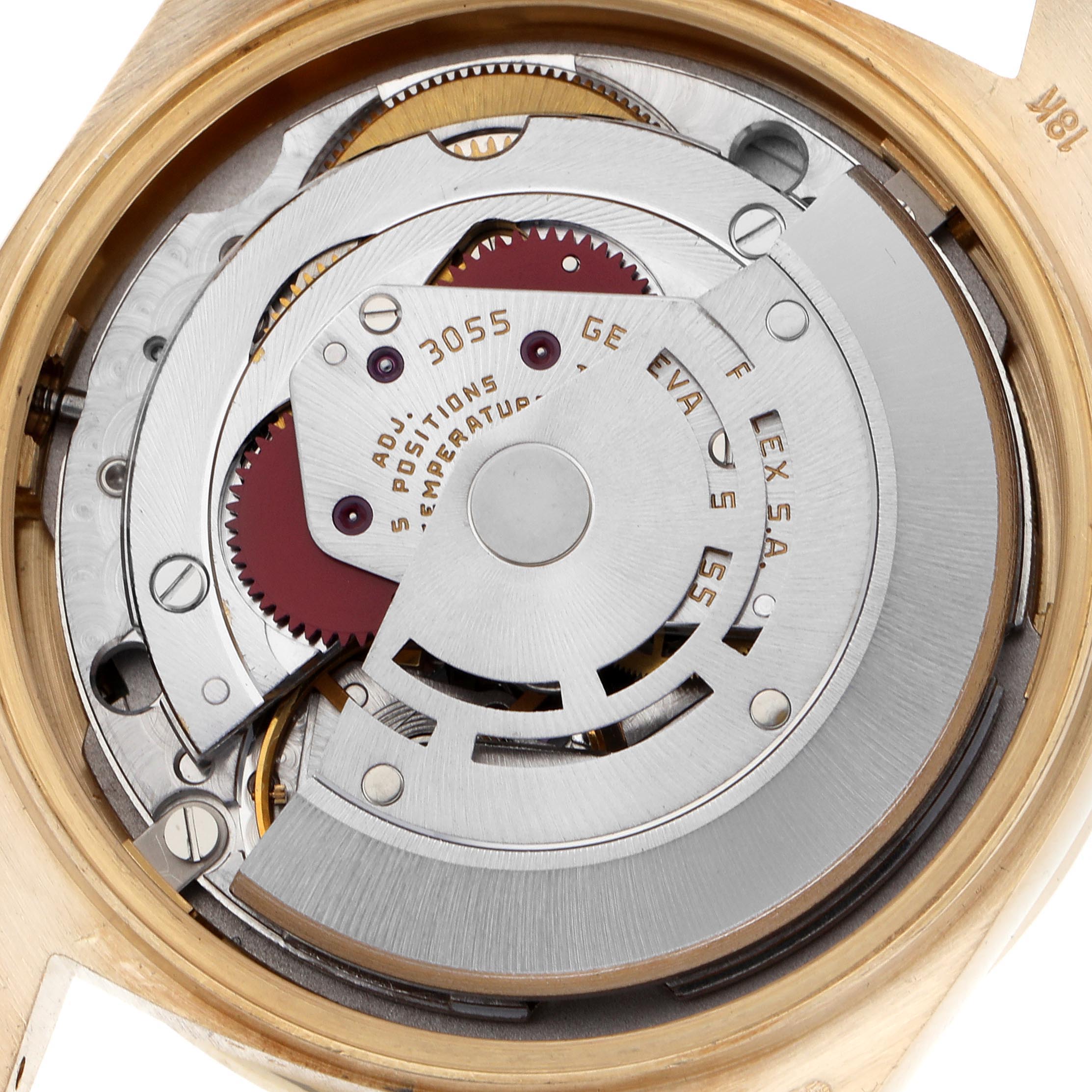 The image shows the movement of a Rolex President 18048 Men's Yellow Gold Champagne Dial 18048 Men's Yellow Gold Champagne Dial model, viewed from the back, revealing gears and mechanical components.