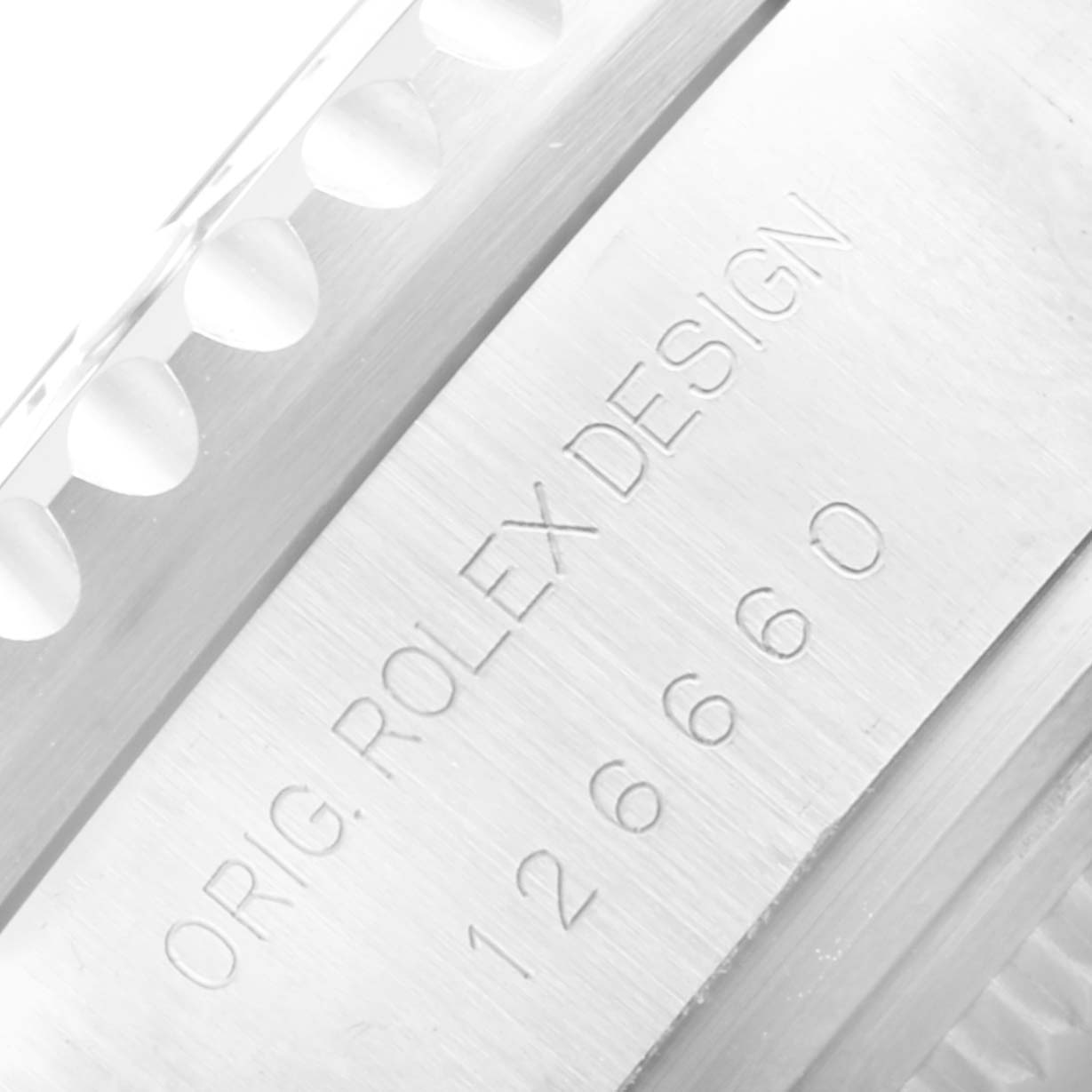 Close-up of the case side of a Rolex Sea-Dweller 126660 Men
s Stainless Steel Black Dial 126660 Men
s Stainless Steel Black Dial, showcasing its model number and "ROLEX DESIGN" engraving.