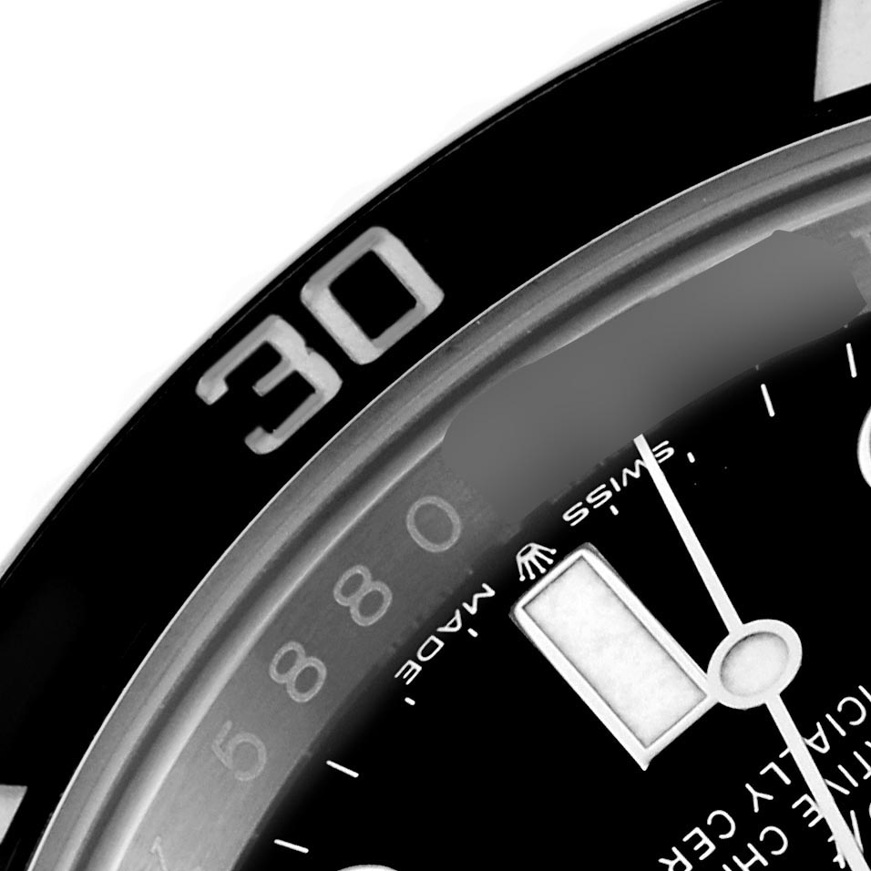 The image shows a close-up of the bezel and part of the dial of a Rolex Submariner 126610LN Men's Stainless Steel Black Dial 126610LN Men's Stainless Steel Black Dial, focusing on the 30-minute mark.