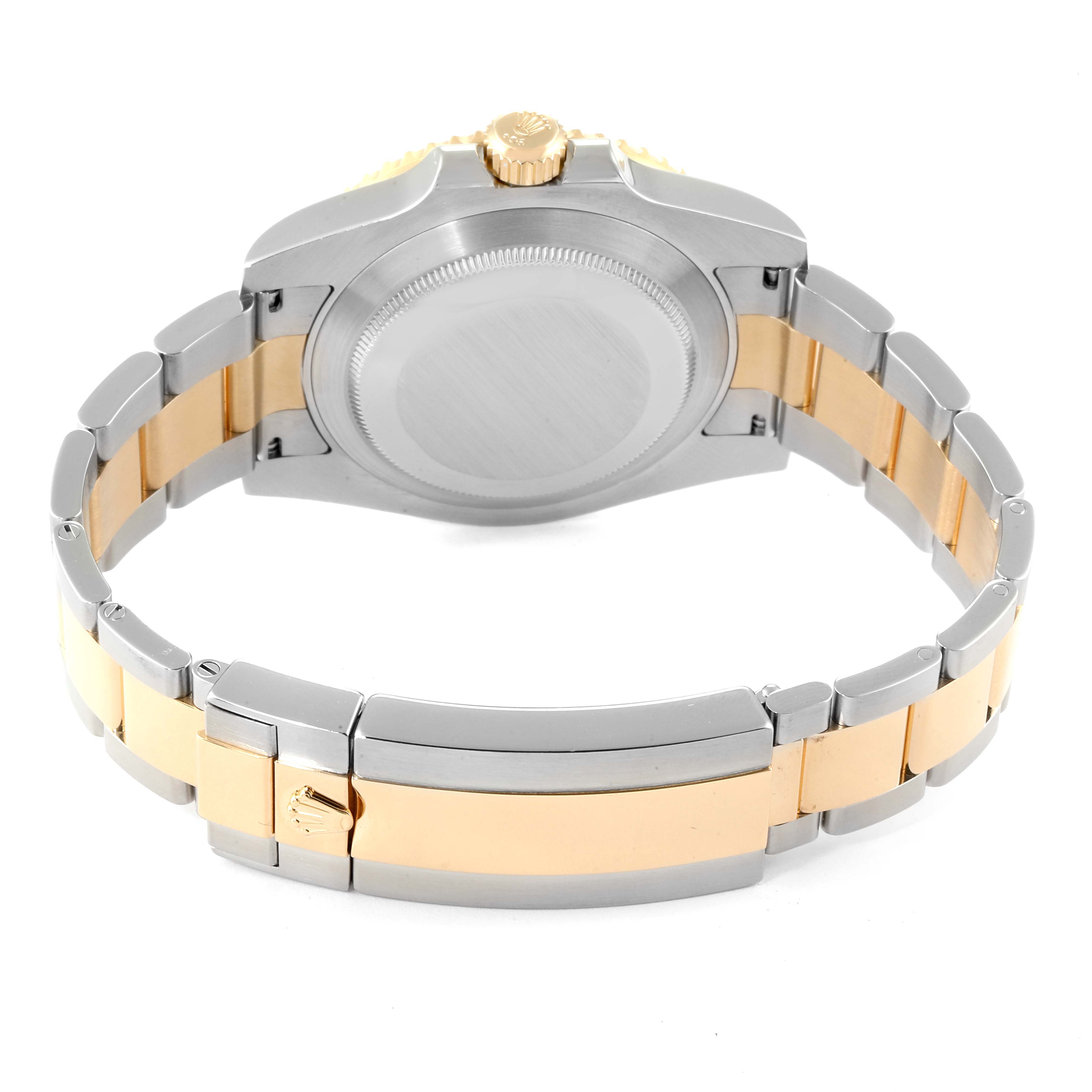 The image shows the back view of a Rolex Submariner 116613 Men
s Stainless Steel Blue Dial 116613 Men
s Stainless Steel Blue Dial watch highlighting its case and two-tone bracelet.