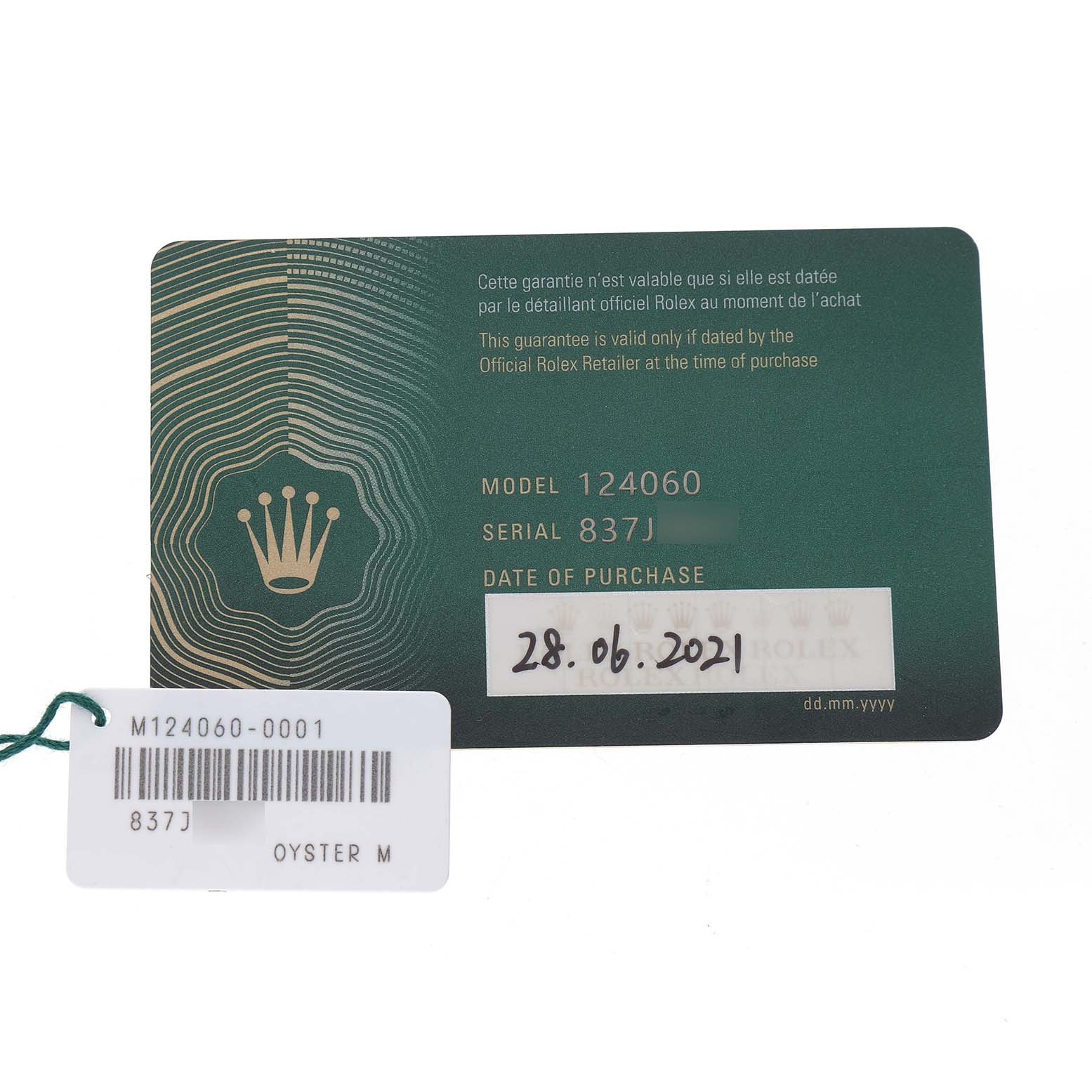 The image shows the warranty card and tag for a Rolex Submariner M124060-0001 Men's Stainless Steel Black Dial model 124060.