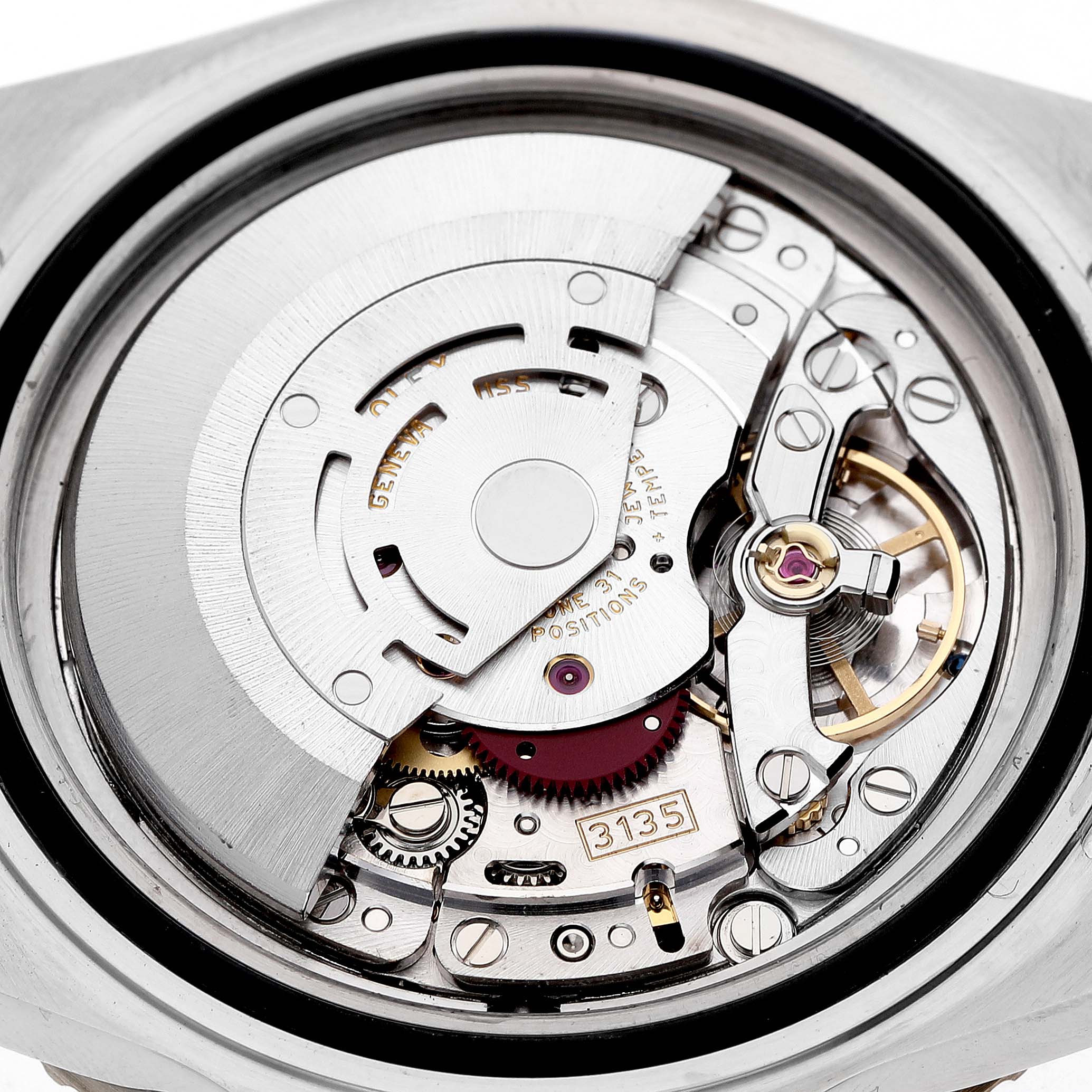 The image shows the inner mechanism of a Rolex Submariner 16613 Men's Steel and Gold (two tone) Blue Dial, highlighting the intricate movement parts, including gears and the rotor.