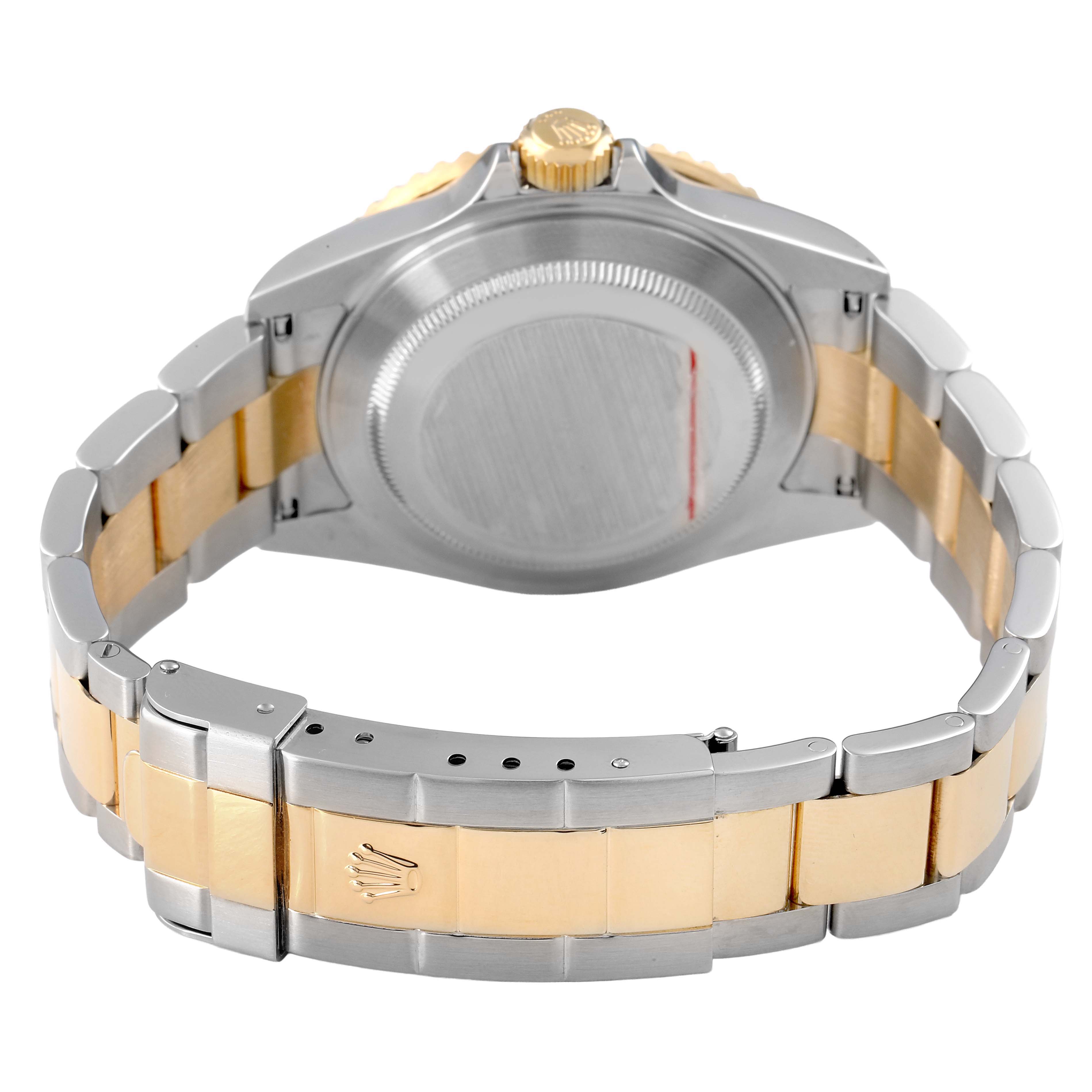 The image shows the back case, crown, and bracelet of a Rolex Submariner 16613 Men's Steel and Gold (two tone) Blue Dial, viewed from the rear.