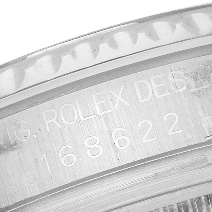 The image shows a close-up of the engraved side of the bezel of a Rolex Yacht-Master 168622 Men's Stainless Steel Silver Dial 168622 Men's Stainless Steel Silver Dial watch.