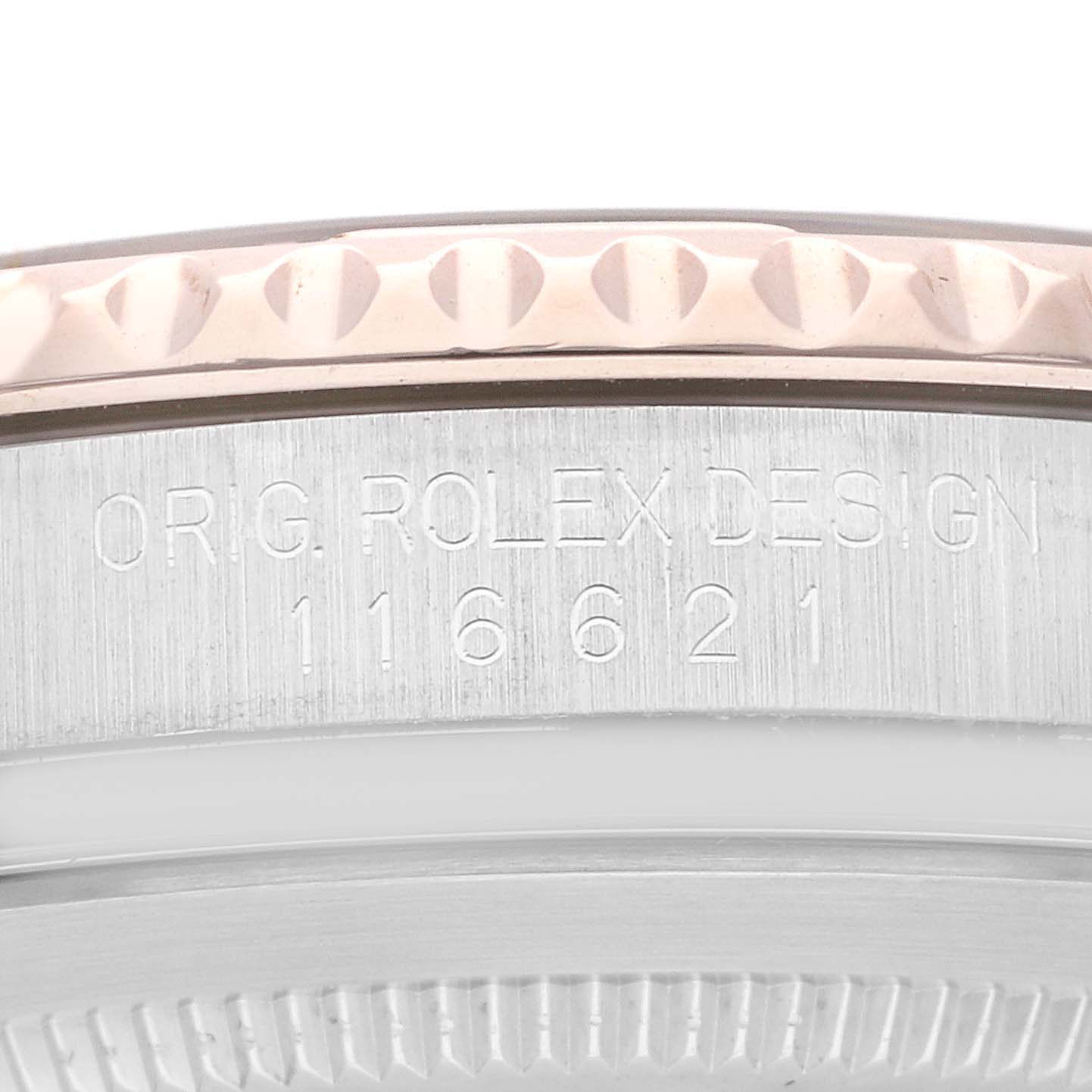 The image shows the side view of the case and bezel of a Rolex Yacht-Master 116621 Men's Steel and Gold (two tone) Brown Dial 116621 Men's Steel and Gold (two tone) Brown Dial watch with the model number engraved.