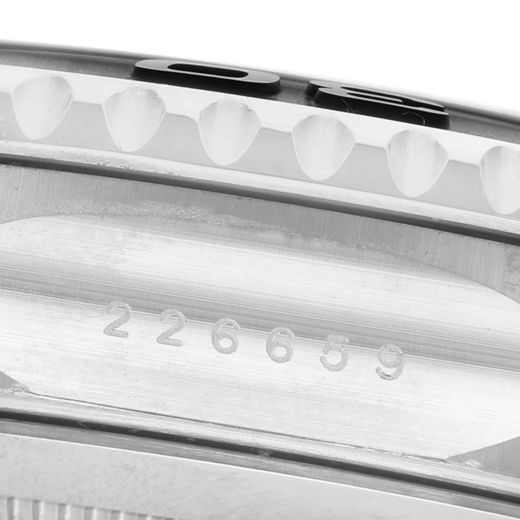 The image shows a detailed side view of the Rolex Yacht-Master 226659 Men's White Gold Black Dial's bezel and part of the case with visible engraving.