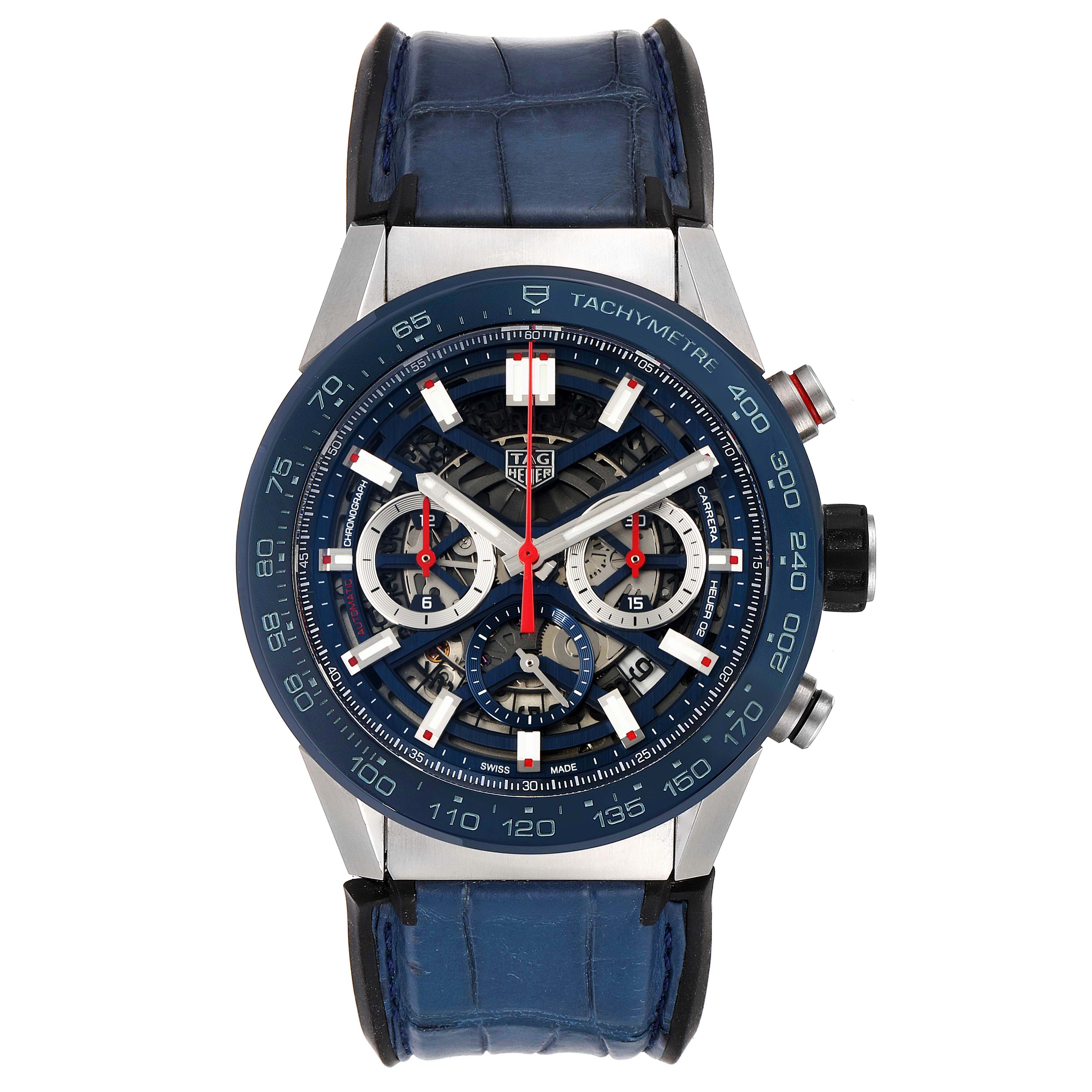 The image shows a front view of a Tag Heuer Carrera CBG2A11.FC6460 Men's Stainless Steel Blue Dial CBG2A11.FC6460 Men's Stainless Steel Blue Dial watch, detailing its blue tachymeter bezel, sub-dials, and blue leather strap.
