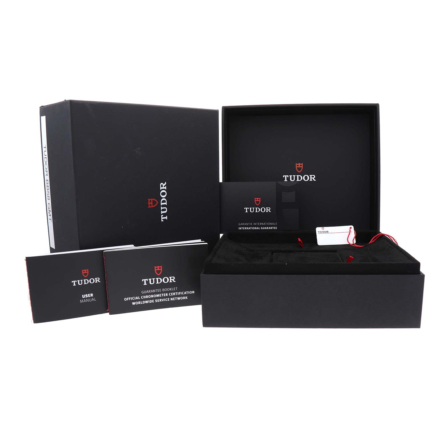 The image shows the Tudor Heritage Black Bay M7939G1A0NRU-0001 Men's Stainless Steel Black Dial packaging, including the box, manuals, and guarantee card.