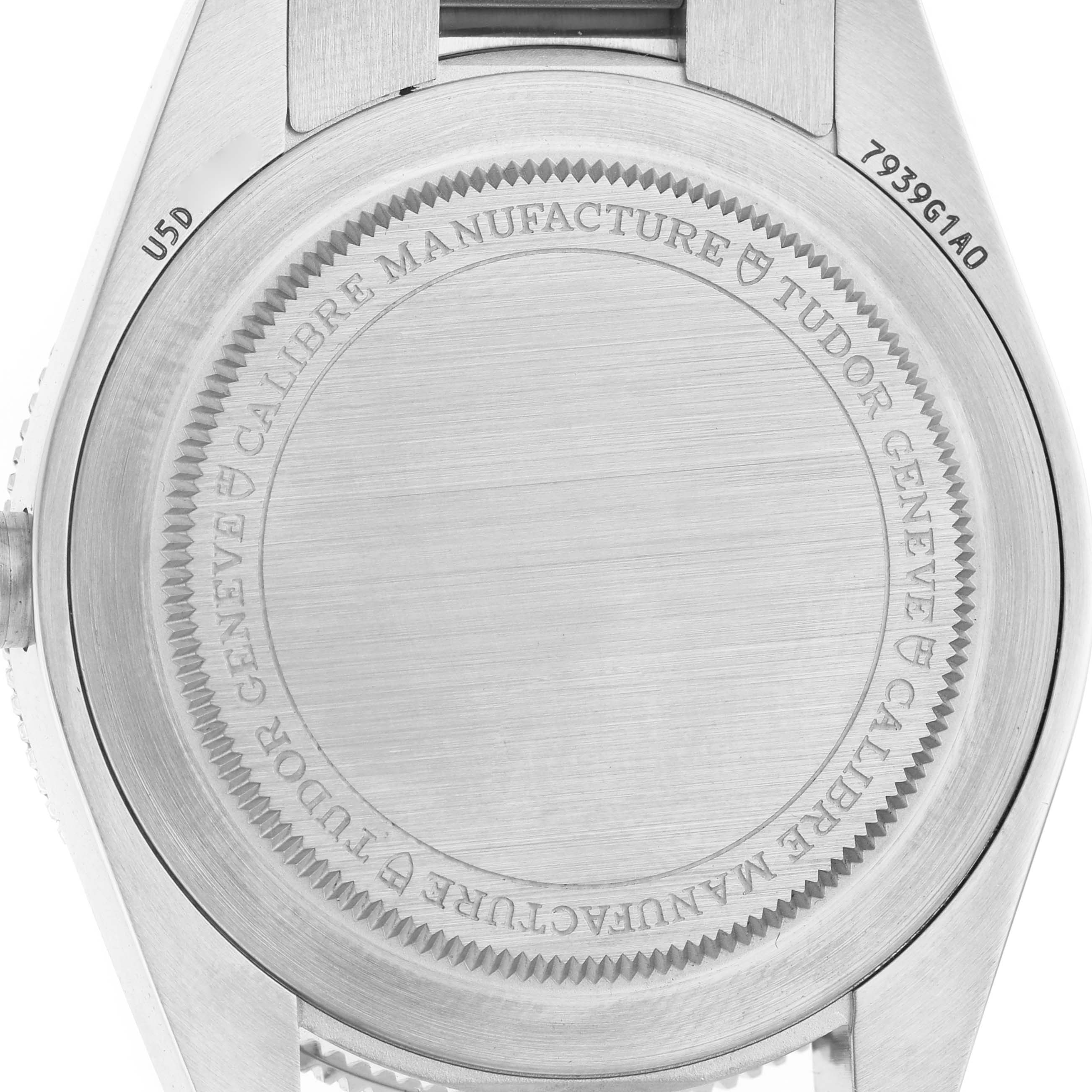 The image shows the back case of the Tudor Heritage Black Bay M7939G1A0NRU-0001 Men's Stainless Steel Black Dial watch, featuring engraved details.