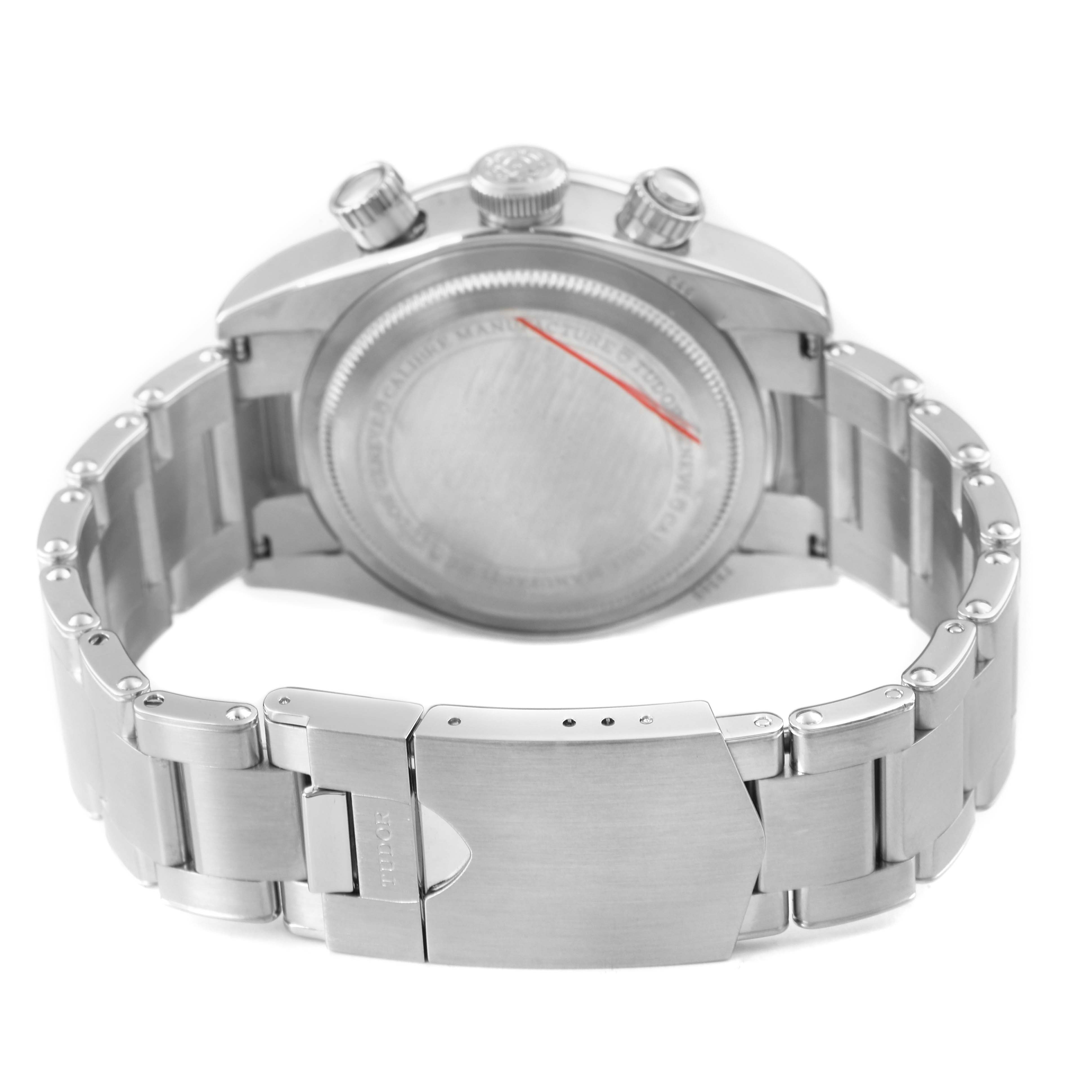 The image shows the back and side view of the Tudor Heritage Chrono 79360N Men's Stainless Steel Silver Dial, featuring the case back, crown, pushers, and metal bracelet with clasp.