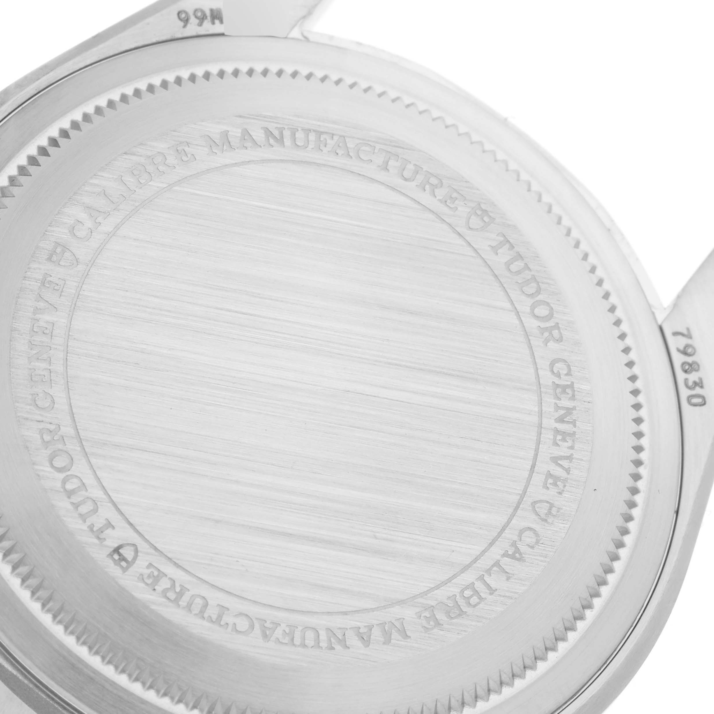 The image shows the back case of a Tudor Heritage Black Bay 79830RB Men's Stainless Steel Black Dial 79830RB Men's Stainless Steel Black Dial watch, displaying inscriptions and engravings.