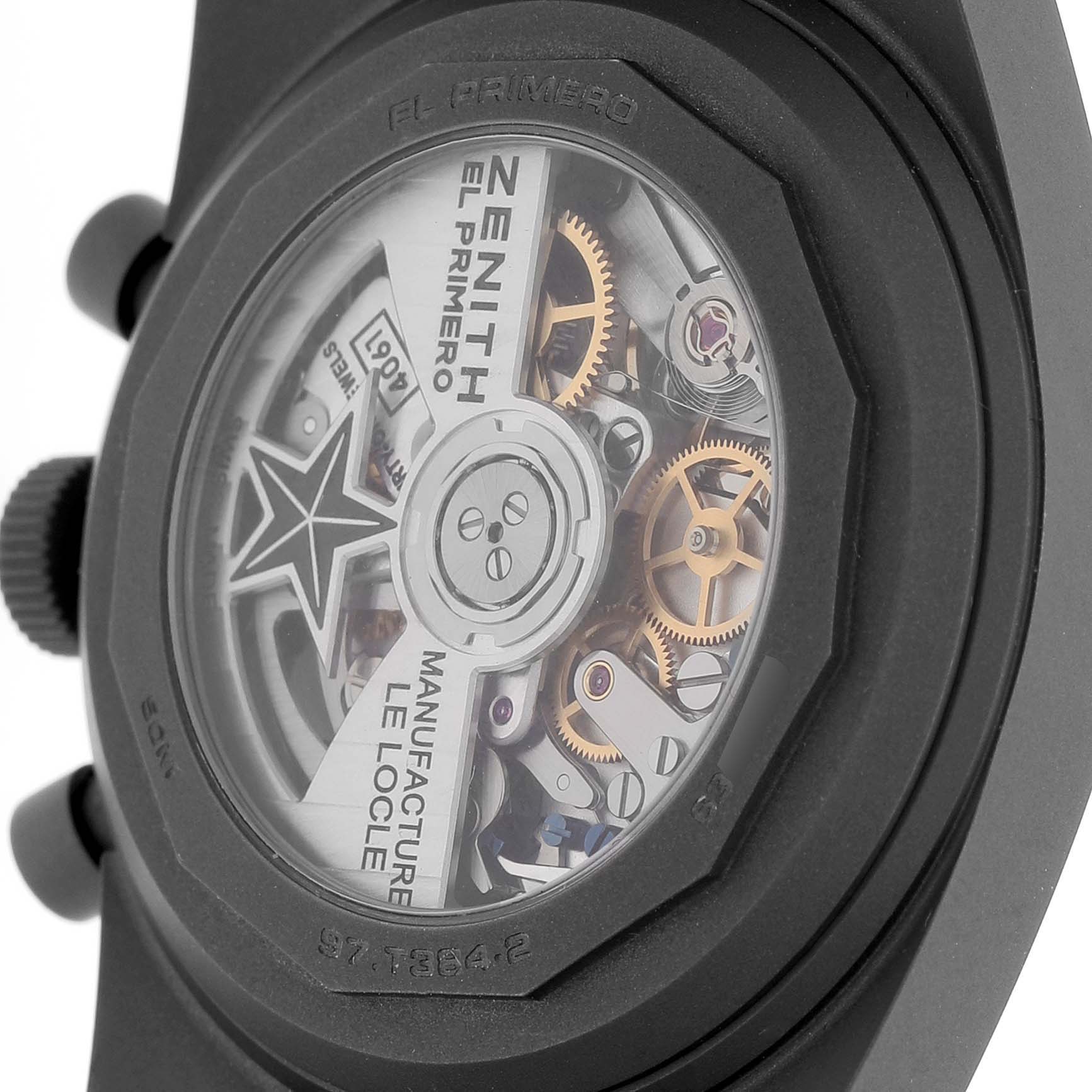 The image shows the back view of a Zenith Chronomaster 97.T384.4061/21.M384 Men's Titanium Black Dial watch, highlighting the intricate movement and gears.