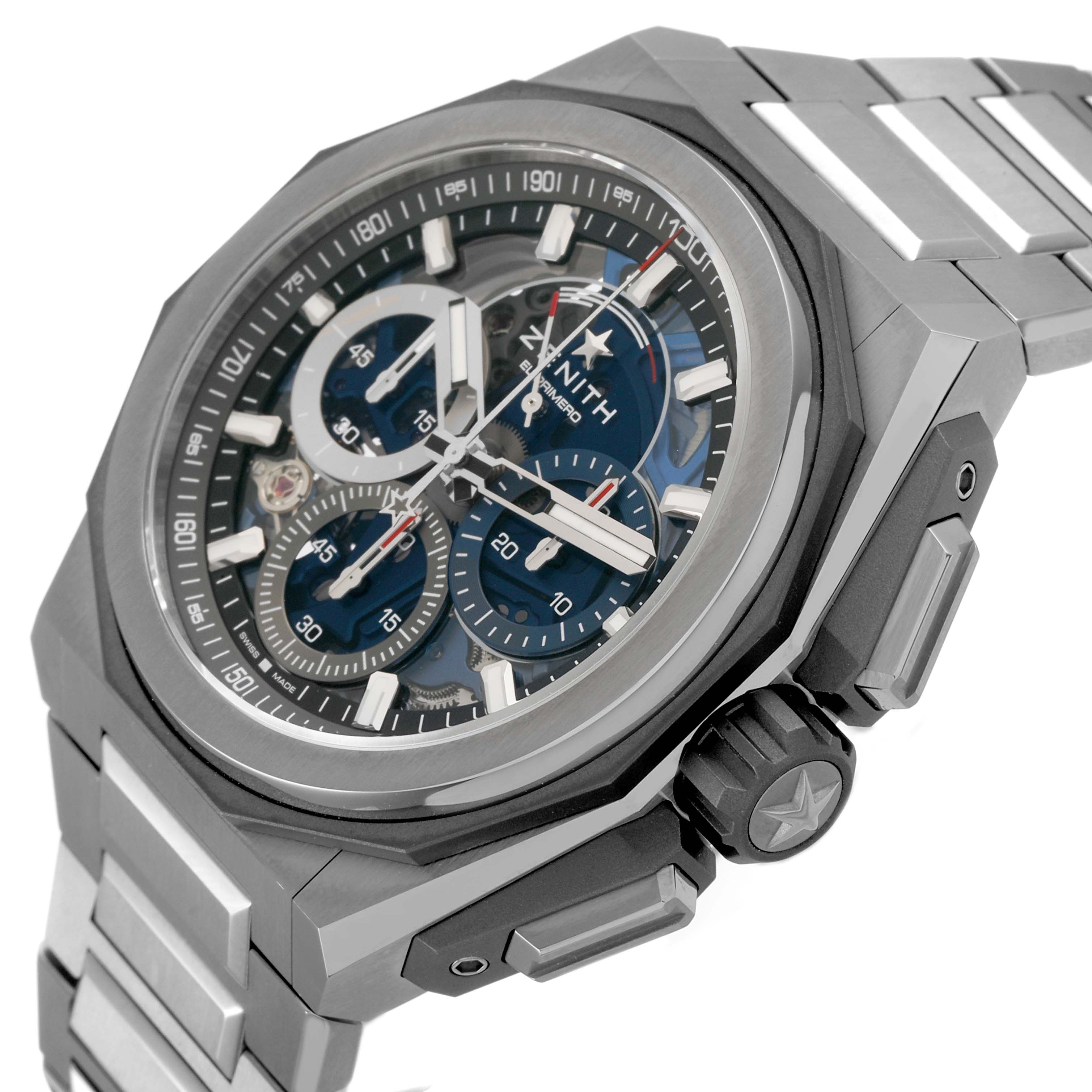 The Zenith Defy 95.9100.9004/01.I001 Men's Titanium Blue Dial watch is shown at an angled side view, displaying the dial, bezel, crown, and part of the bracelet.