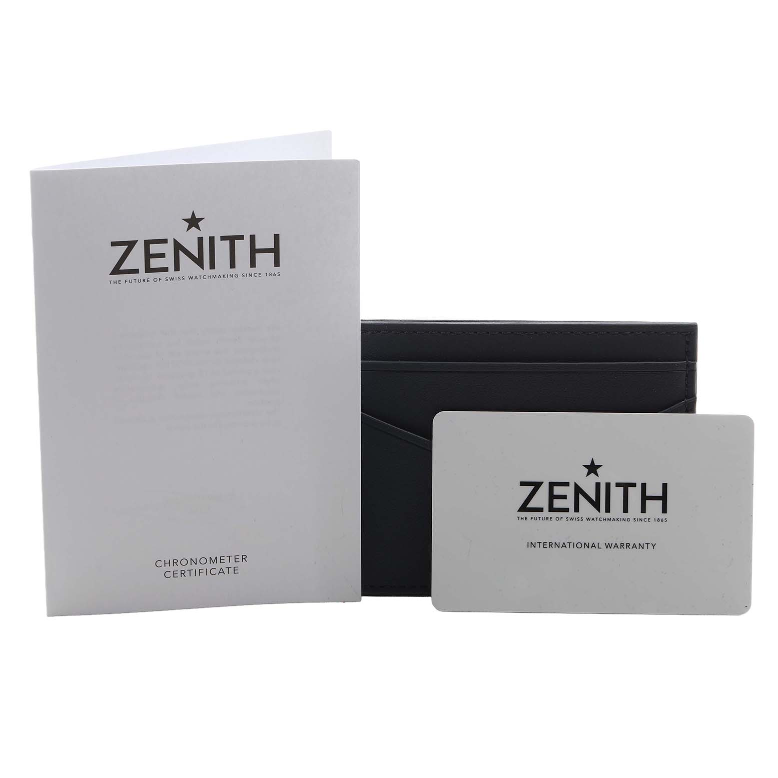 The image shows accessories for the Zenith Defy 95.9100.9004/01.I001 Men's Titanium Blue Dial model, including a chronometer certificate, warranty card, and a case.