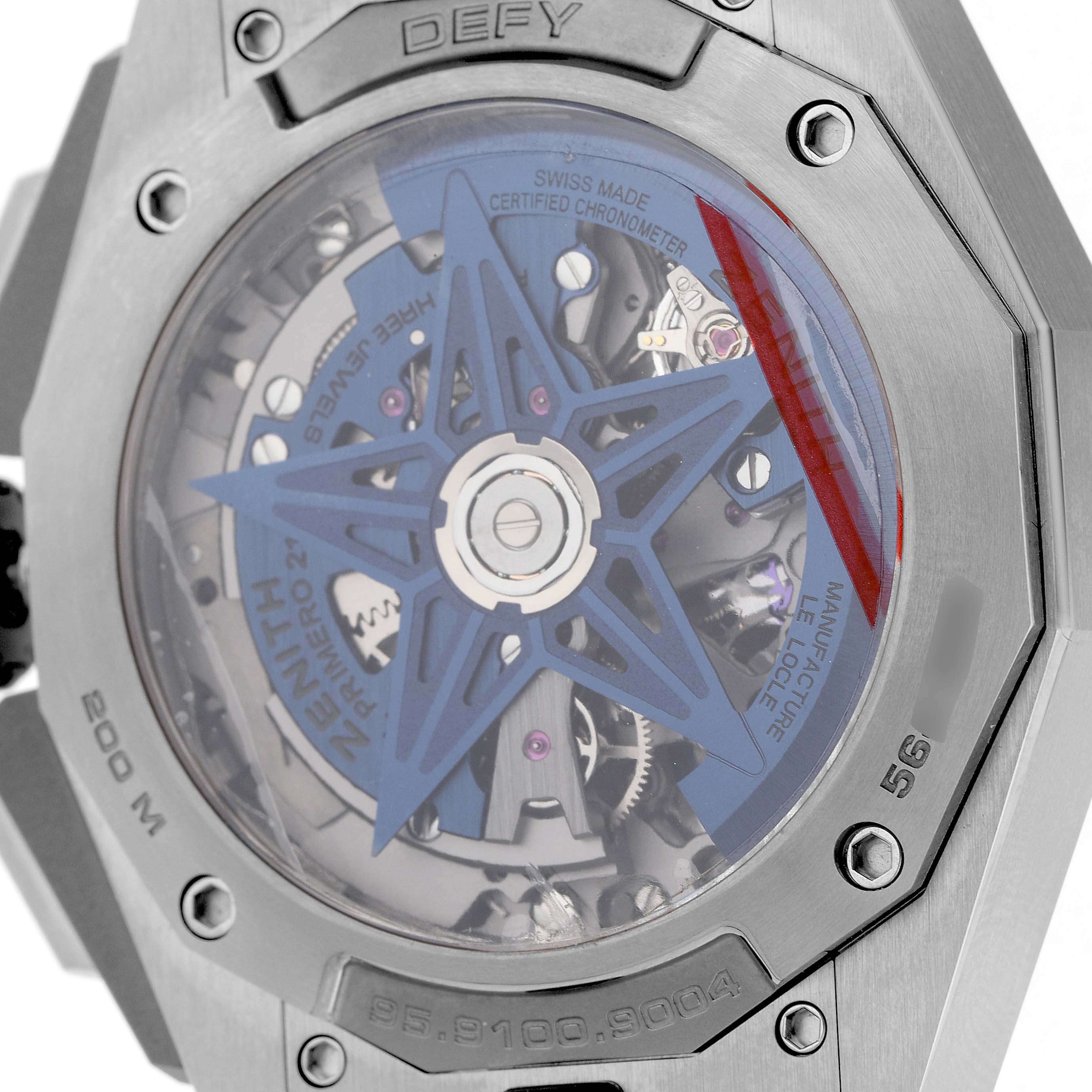 The image shows the back of the Zenith Defy 95.9100.9004/01.I001 Men's Titanium Blue Dial watch, highlighting the movement and rotor through the transparent case back.