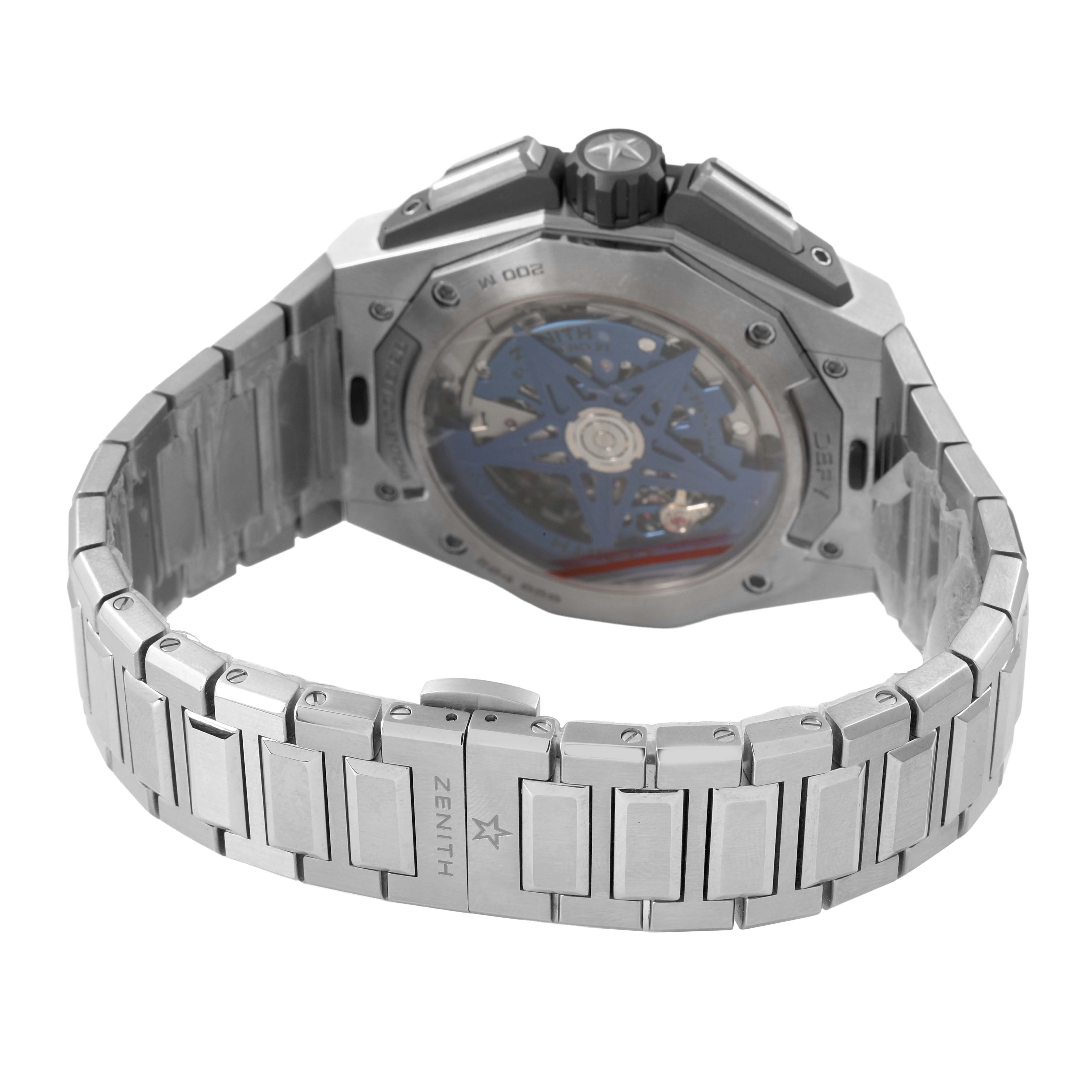 The Zenith Defy 95.9100.9004/01.I001 Men's Titanium Blue Dial watch is shown from the back, highlighting its closed case with visible internal mechanics and metal bracelet.