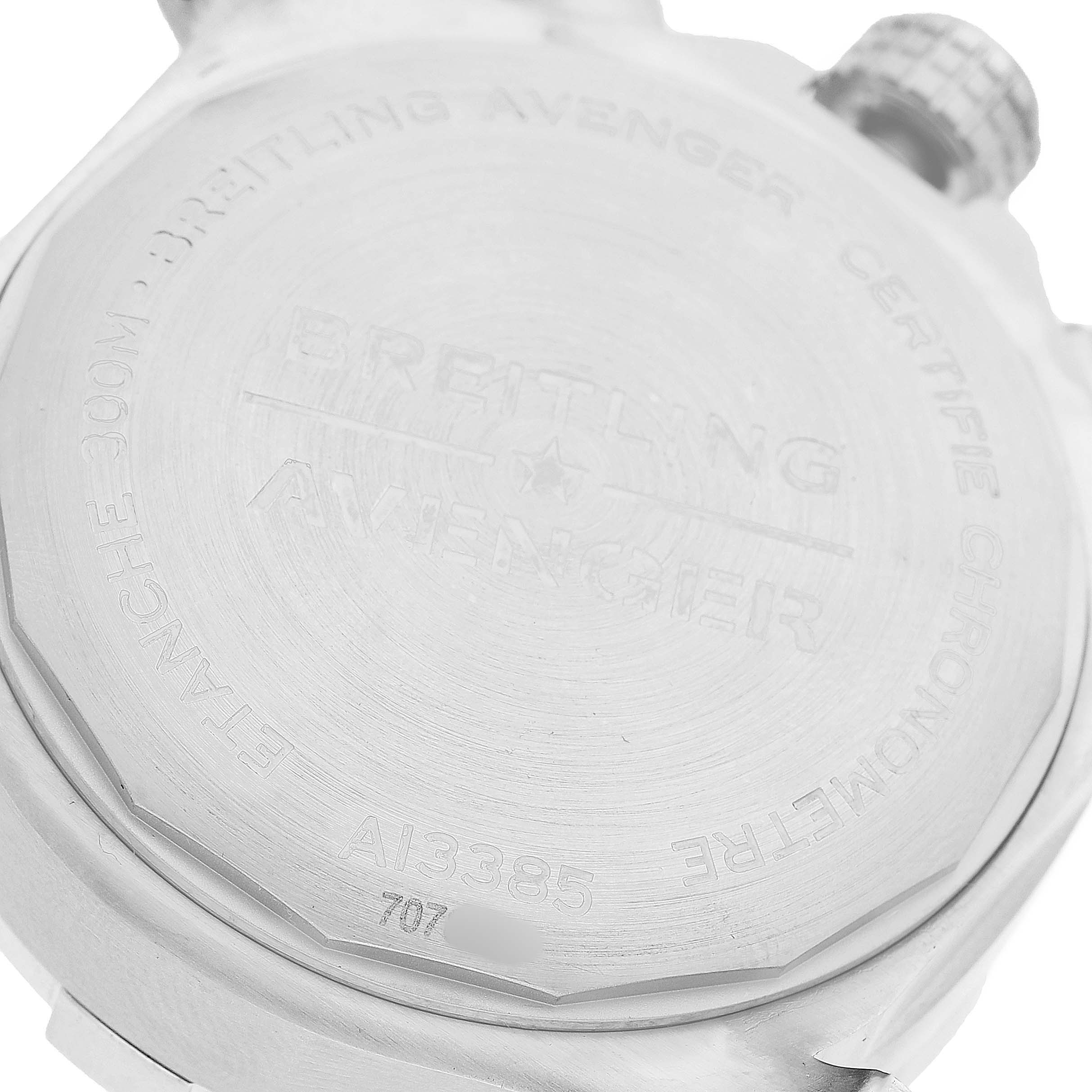 The image shows the back casing of a Breitling Avenger A13385101C1A1 Men's Stainless Steel Blue Dial watch, highlighting the engraved model details.