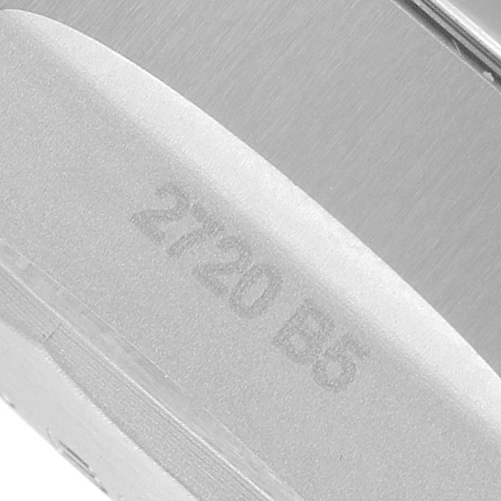 The image shows a close-up of the side of a Breitling Avenger A13385101C1A1 Men's Stainless Steel Blue Dial watch, highlighting the bracelet links and engraving.