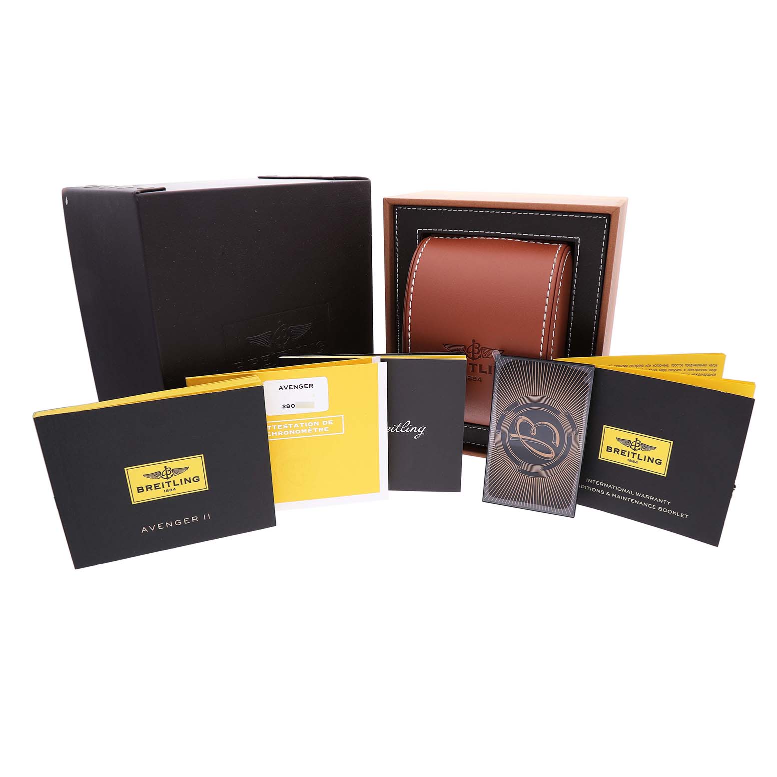 The image shows packaging and accessories for the Breitling Avenger A1338111 / F564 Men's Stainless Steel Black Dial, including a box, pouch, and several booklets.