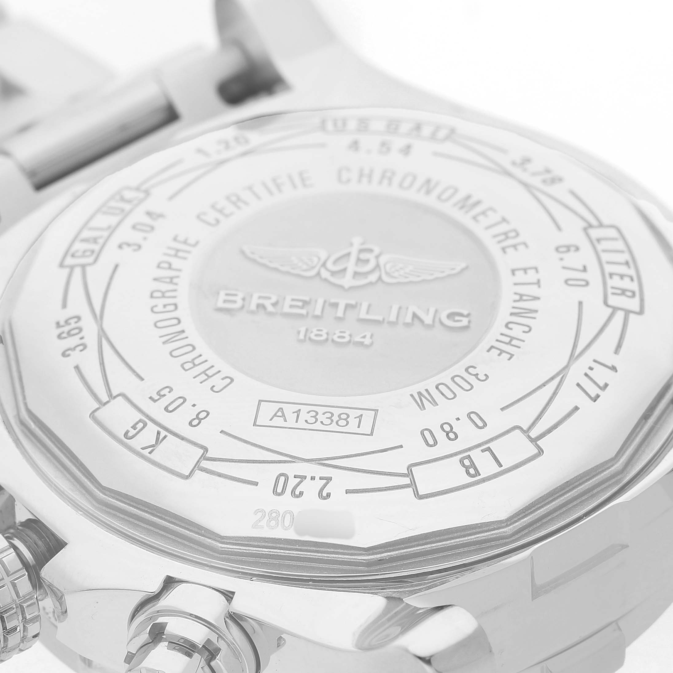 The image shows the case back of a Breitling Avenger A1338111 / F564 Men's Stainless Steel Black Dial watch, featuring brand engravings and model details.