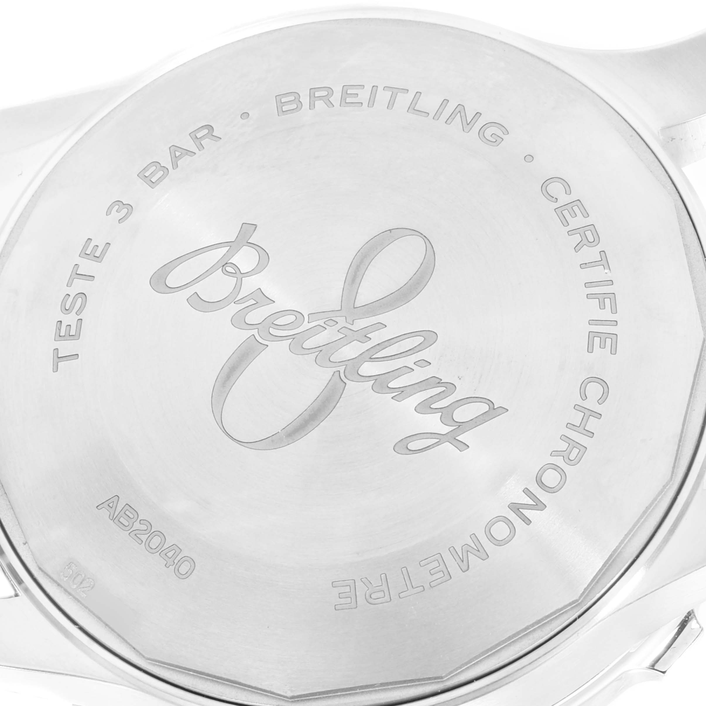 This image shows the case back of a Breitling Navitimer watch, highlighting the brand name and certification details.