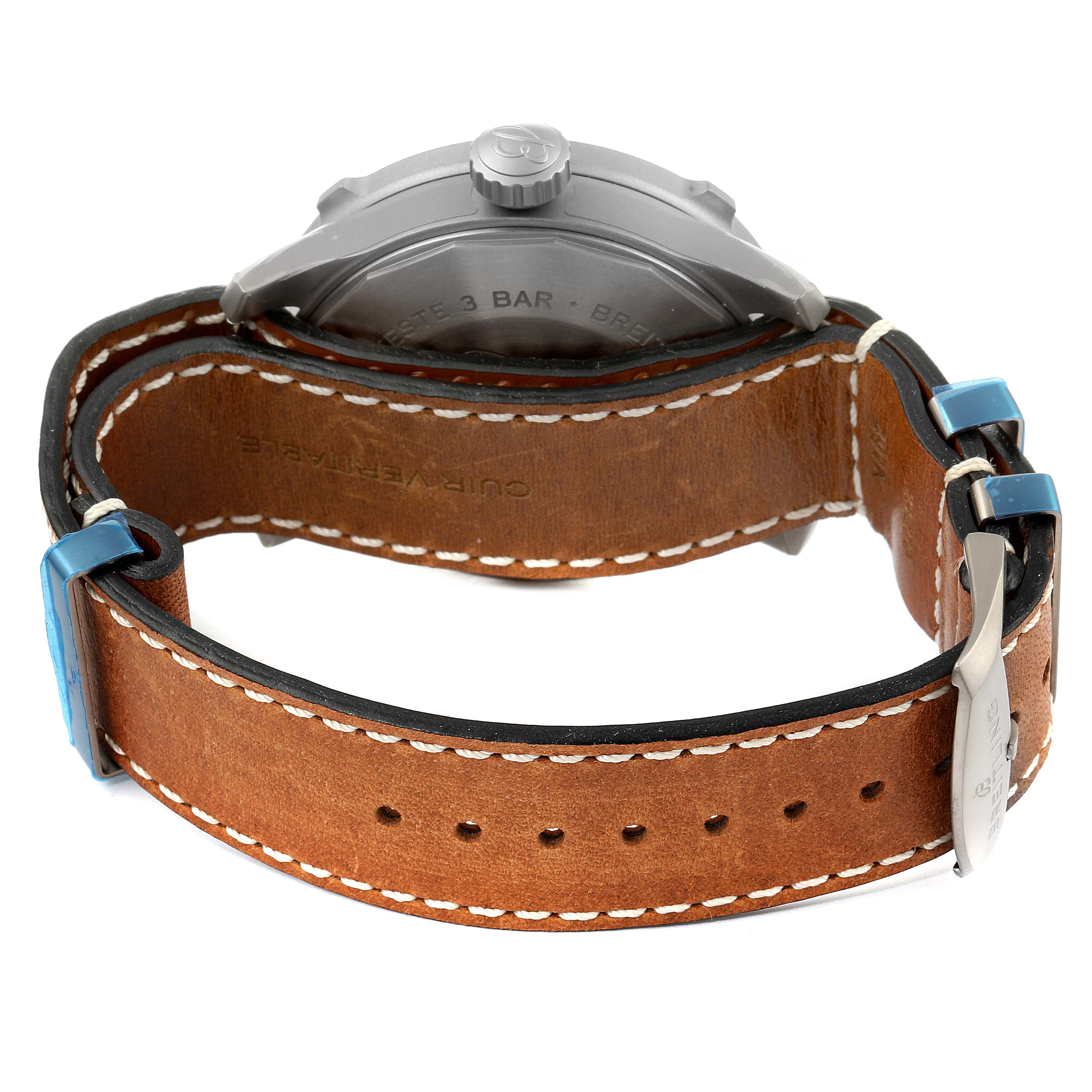 This image shows the rear view of a Breitling Navitimer watch, highlighting its case back and brown leather strap.