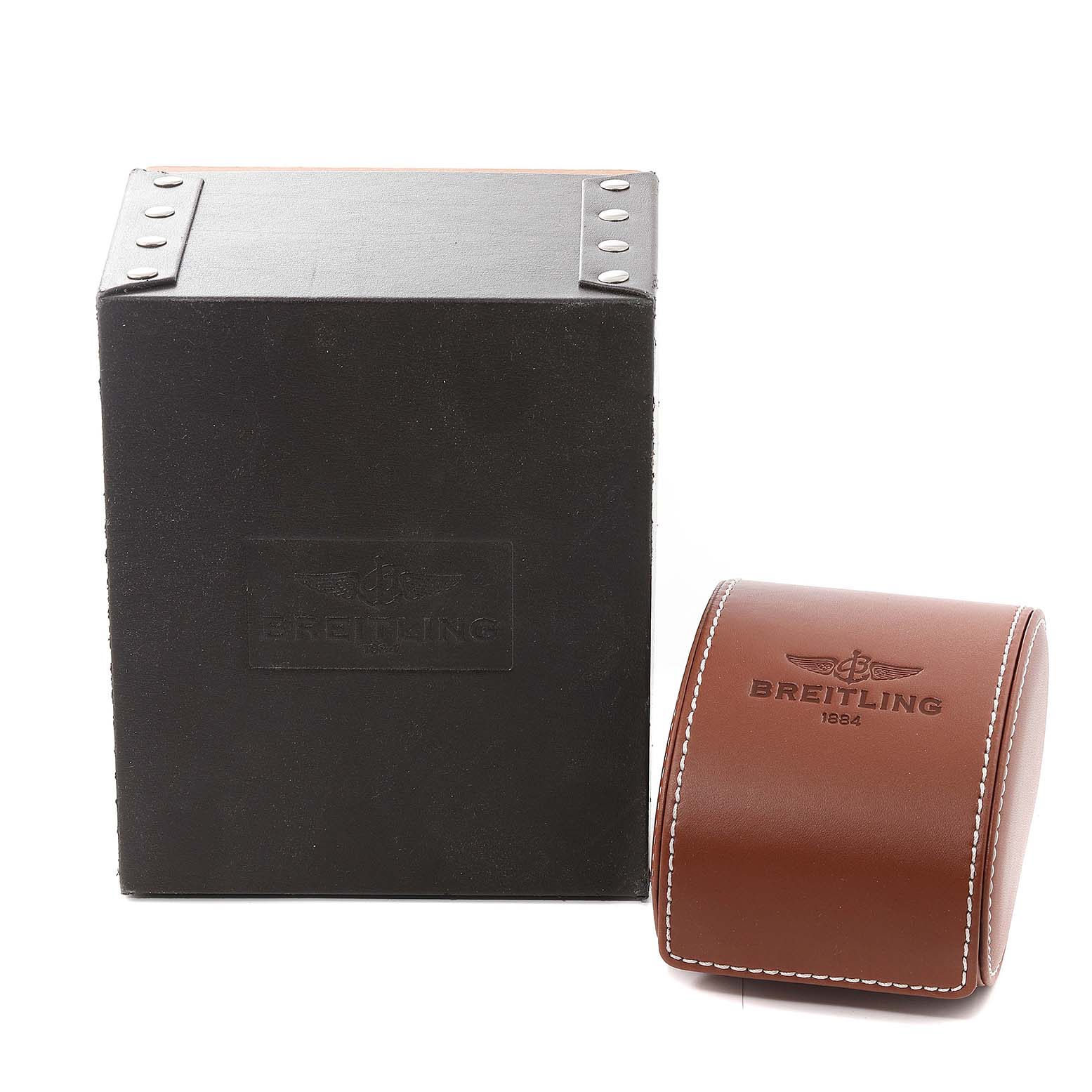 The image shows the packaging and case for the Breitling Navitimer A23330 Men's Stainless Steel Silver Dial A23330 Men's Stainless Steel Silver Dial model, featuring a black box and a curved brown leather case.