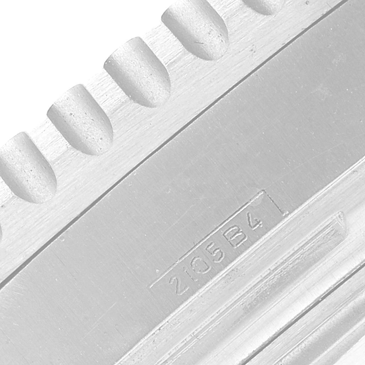 This image captures a close-up view of the bezel and markings on the side of a Breitling Navitimer A23330 Men's Stainless Steel Silver Dial A23330 Men's Stainless Steel Silver Dial watch.