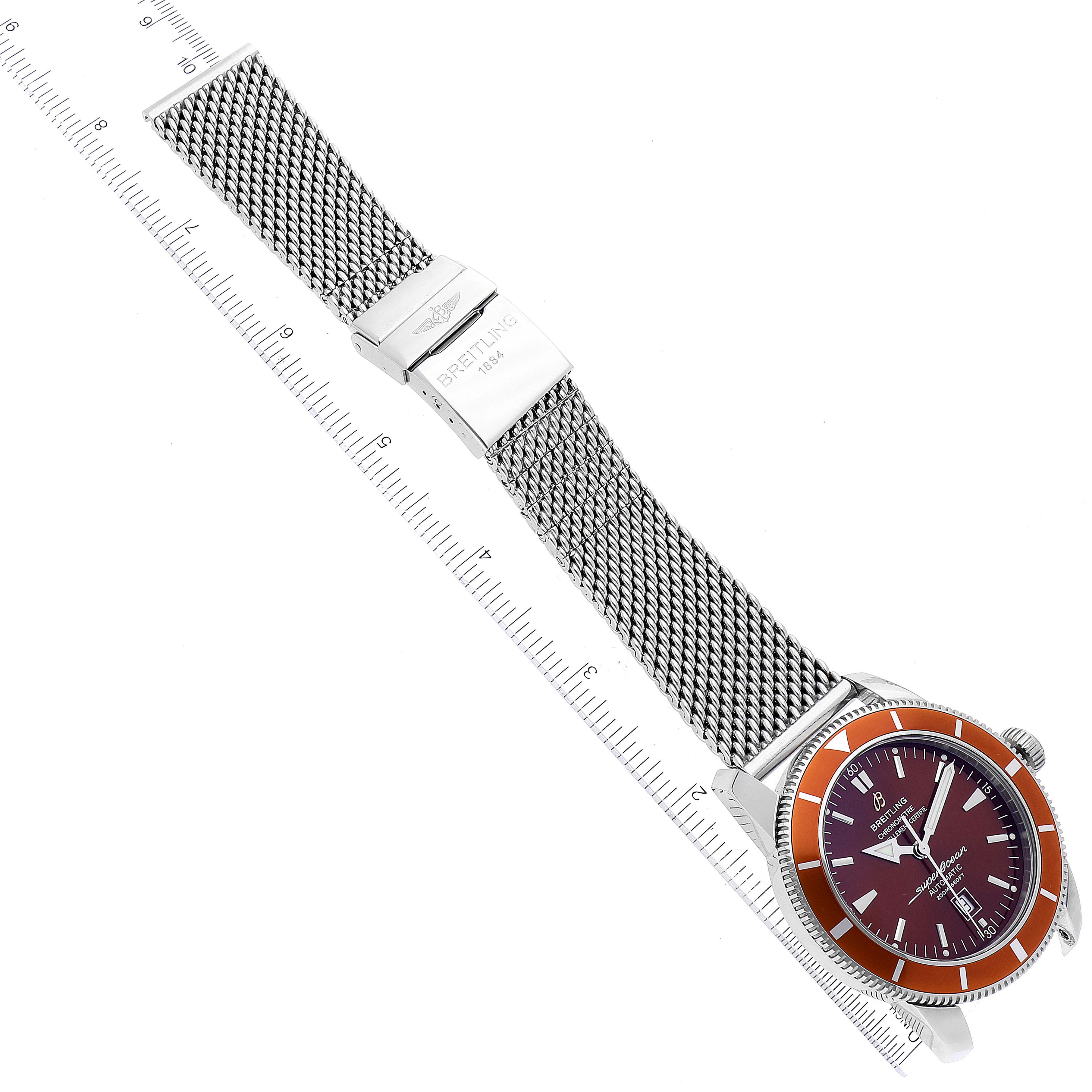 The Breitling Superocean A17320 Men's Stainless Steel Brown Dial A17320 Men's Stainless Steel Brown Dial watch is shown from a top-down angle, displaying the entire face, bezel, and mesh band with clasp.