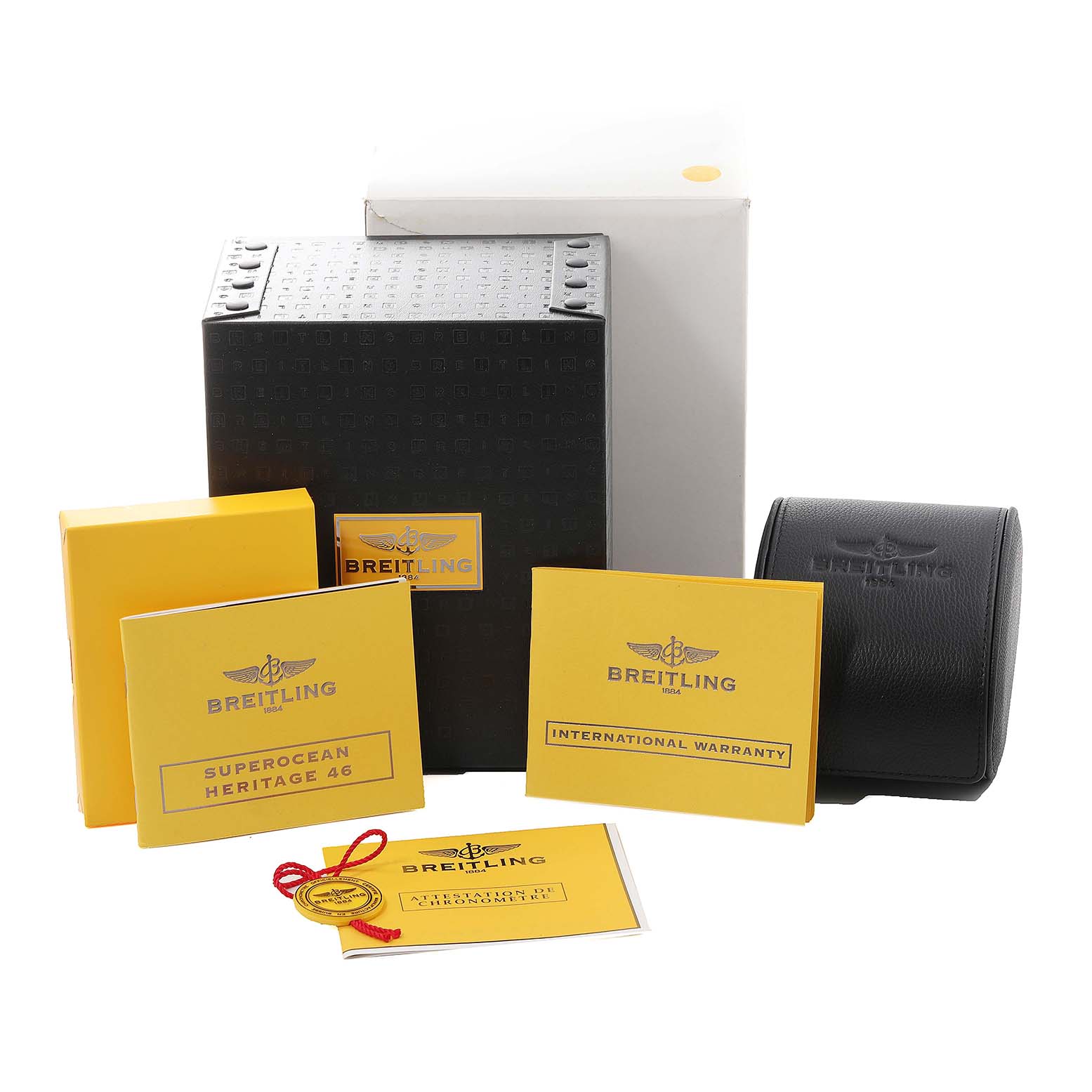 This image shows the packaging and accessories for the Breitling Superocean A17320 Men's Stainless Steel Brown Dial A17320 Men's Stainless Steel Brown Dial watch, including boxes, manuals, and warranty cards.