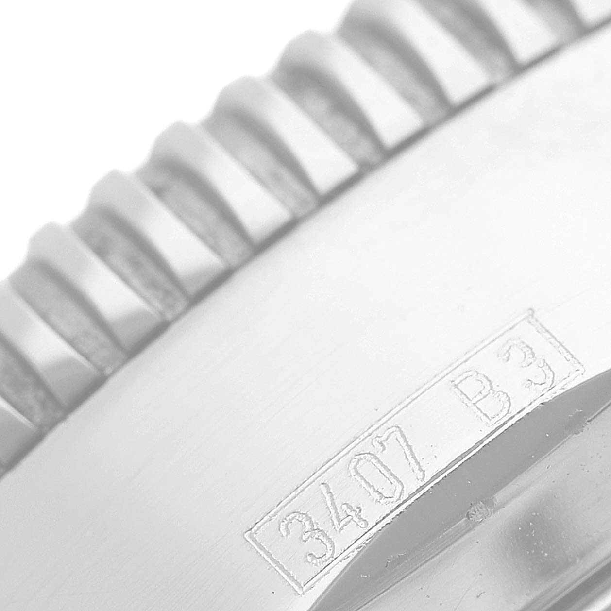 The close-up image shows the detailed edge of the bezel and part of the casing with the engraving on a Breitling Superocean A17320 Men's Stainless Steel Brown Dial A17320 Men's Stainless Steel Brown Dial watch.