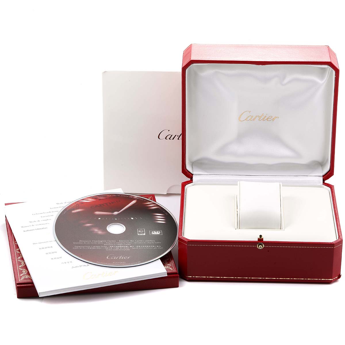 The image shows the packaging, manual, and disc for a Calibre de Cartier watch by Cartier.