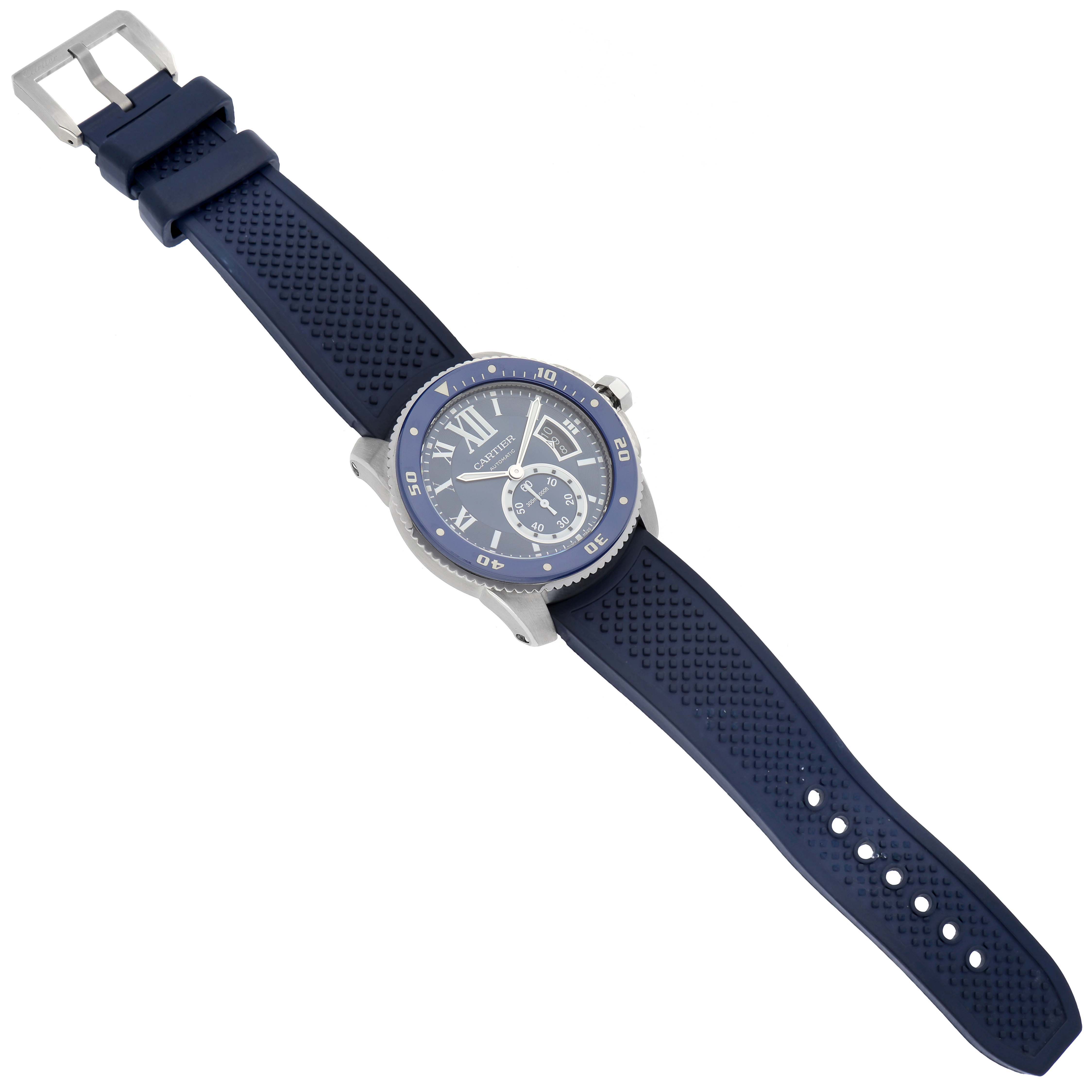 This image shows a Calibre de Cartier watch by Cartier from a top-down perspective, displaying its blue strap and face.