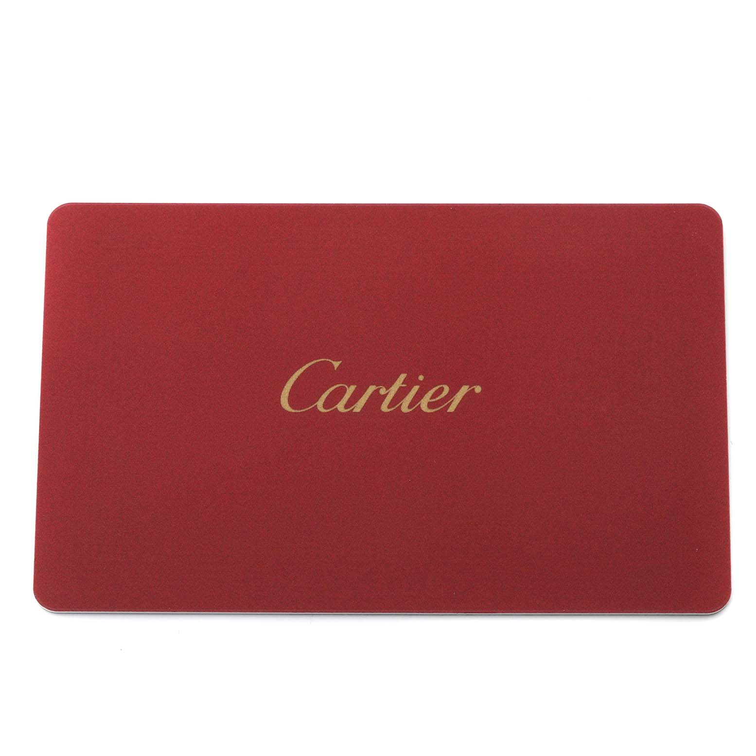 The image shows a red card with the gold "Cartier" logo, an accessory for the Drive de Cartier model by Cartier.