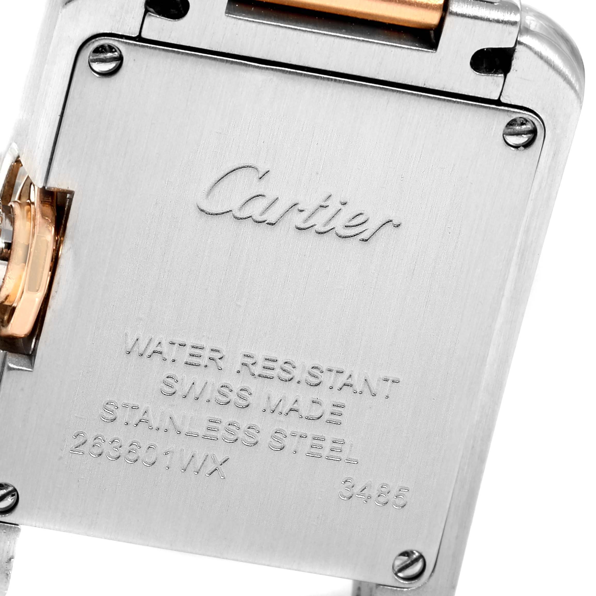 The image shows the back case of a Cartier Tank Anglaise WT100024 Women's Steel and Gold (two tone) Silver Dial WT100024 Women's Steel and Gold (two tone) Silver Dial watch, highlighting its stainless steel material and inscriptions.