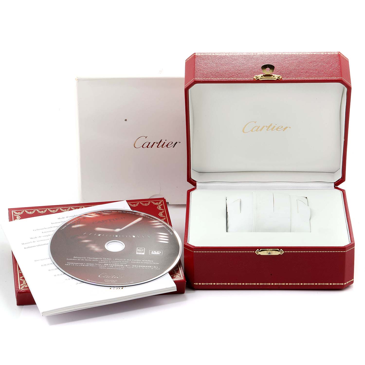 This image shows the packaging and accessories for a Cartier Tank Anglaise WT100024 Women's Steel and Gold (two tone) Silver Dial WT100024 Women's Steel and Gold (two tone) Silver Dial watch, including a box, booklet, and a DVD.