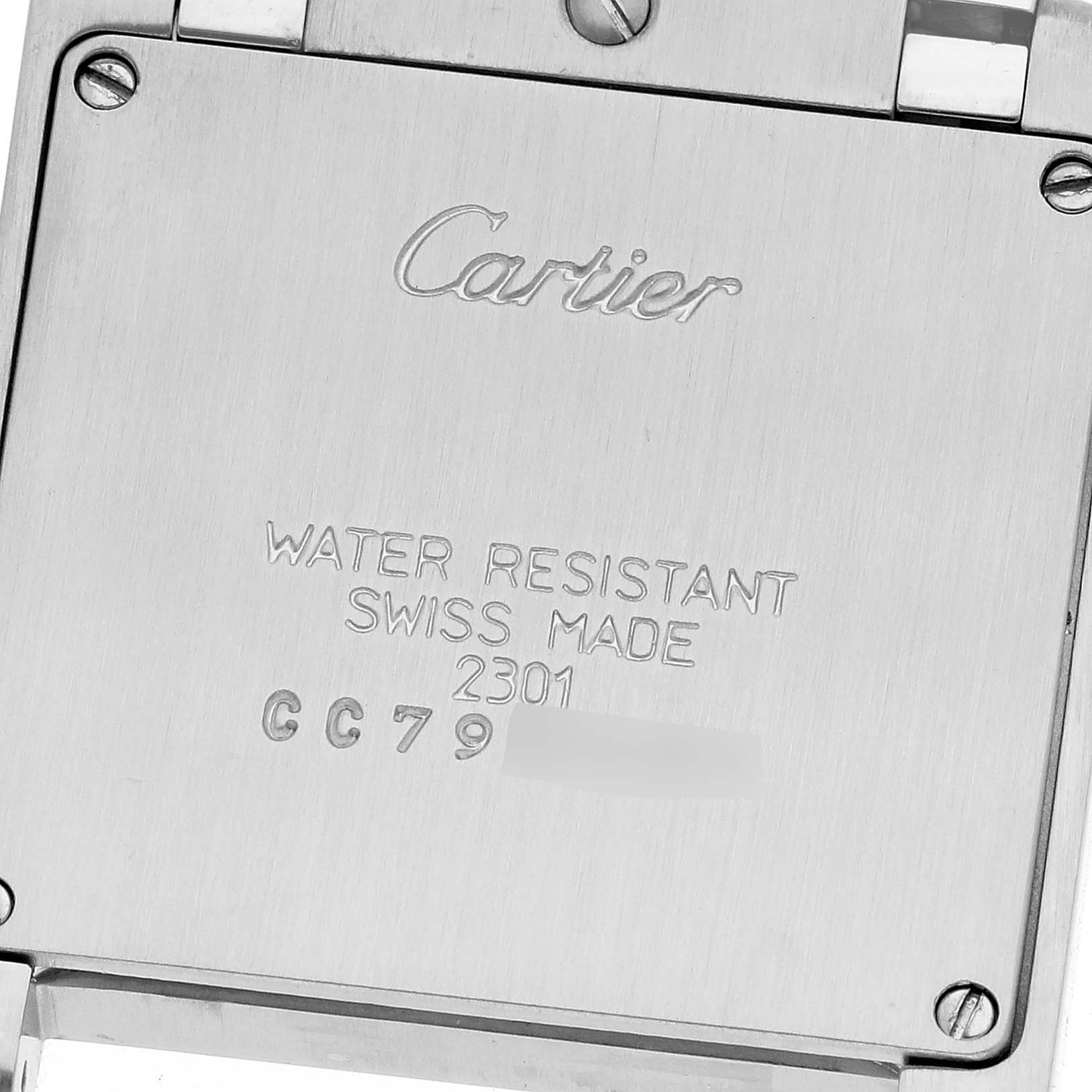 This image shows the back case of a Cartier Tank Francaise W51003Q3 Women
s Stainless Steel Silver Dial W51003Q3 Women
s Stainless Steel Silver Dial watch, highlighting its inscriptions and screw details.