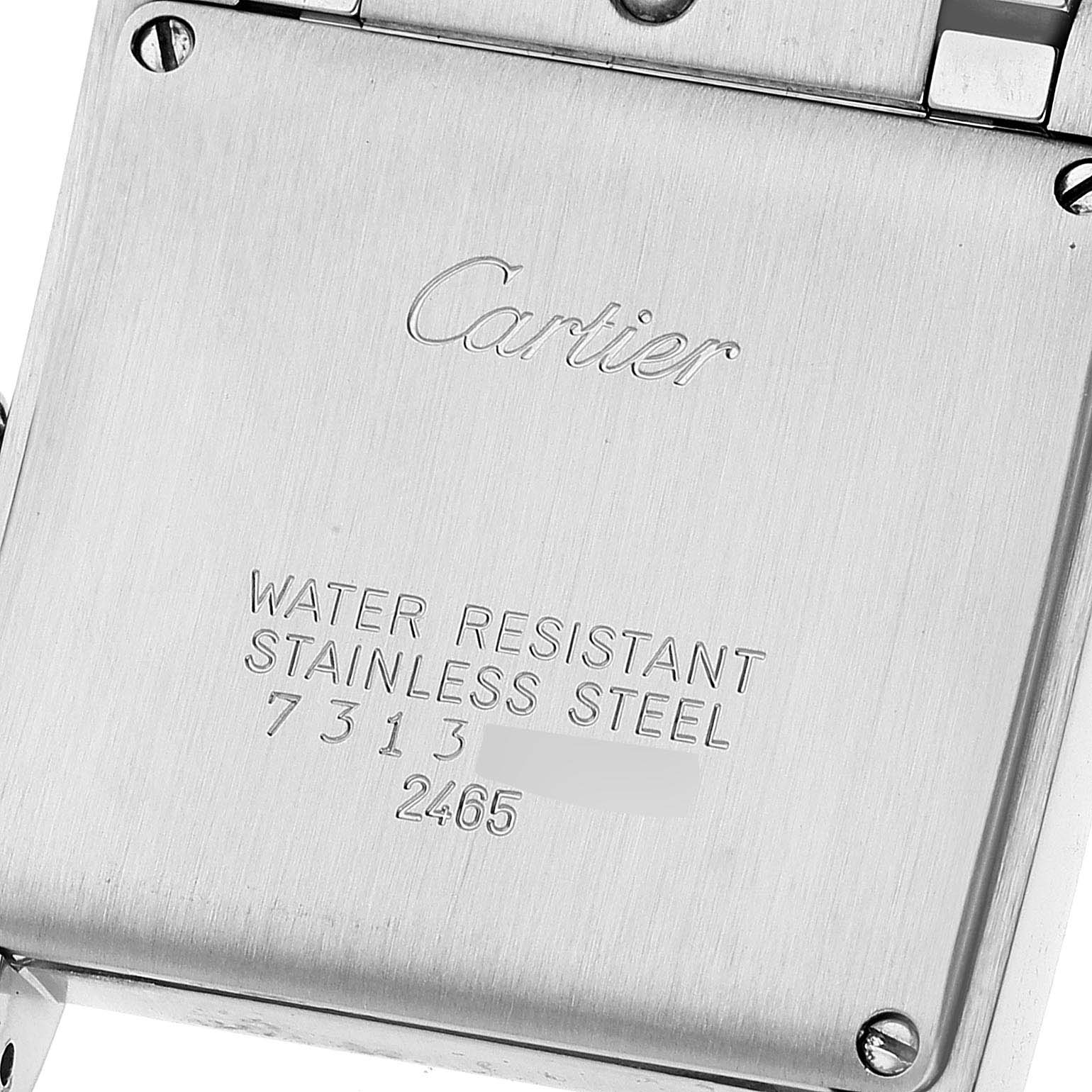 This image shows the back case of a Cartier Tank Francaise W51012Q4 Women's Steel and Gold (two tone) Silver Dial W51012Q4 Women's Steel and Gold (two tone) Silver Dial watch with engraved details about its material and water resistance.