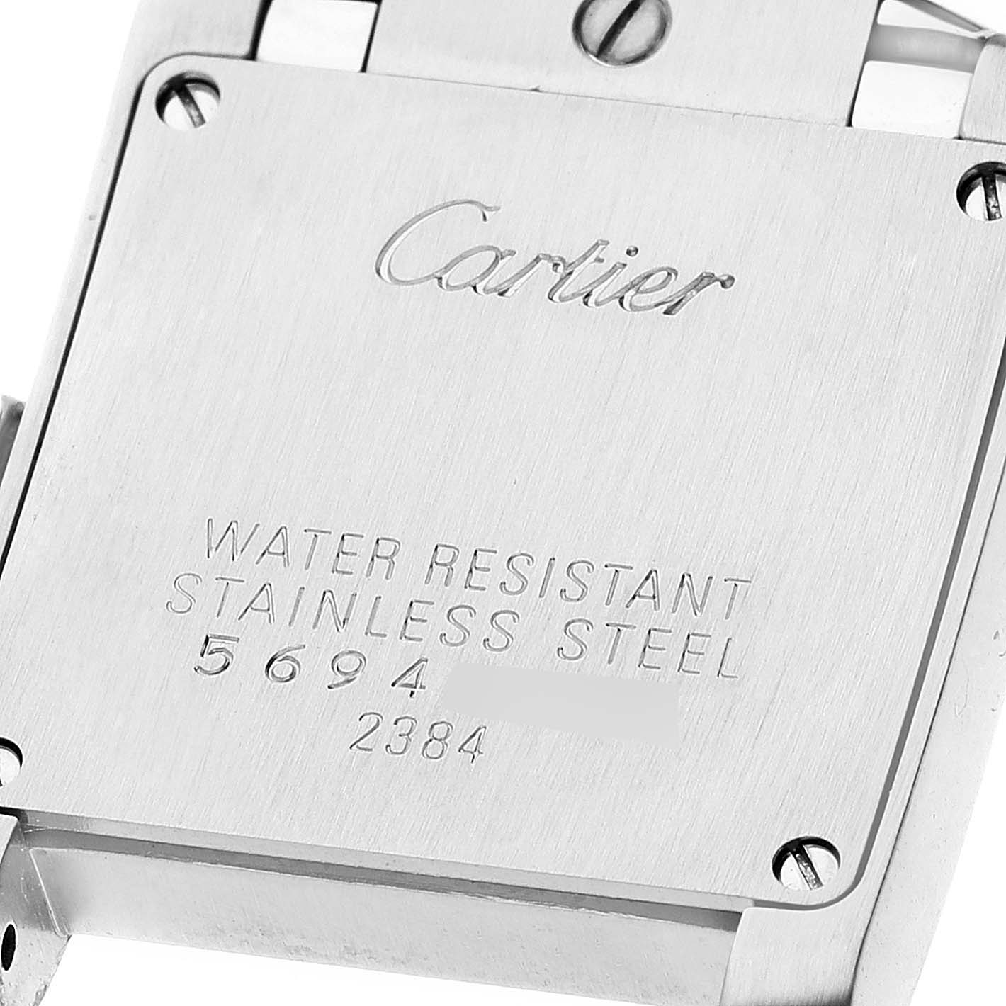 This is a close-up view of the back case of a Cartier Tank Francaise W51030Q3 Women's Stainless Steel White Dial W51030Q3 Women's Stainless Steel White Dial watch, highlighting its engravings and stainless steel construction.