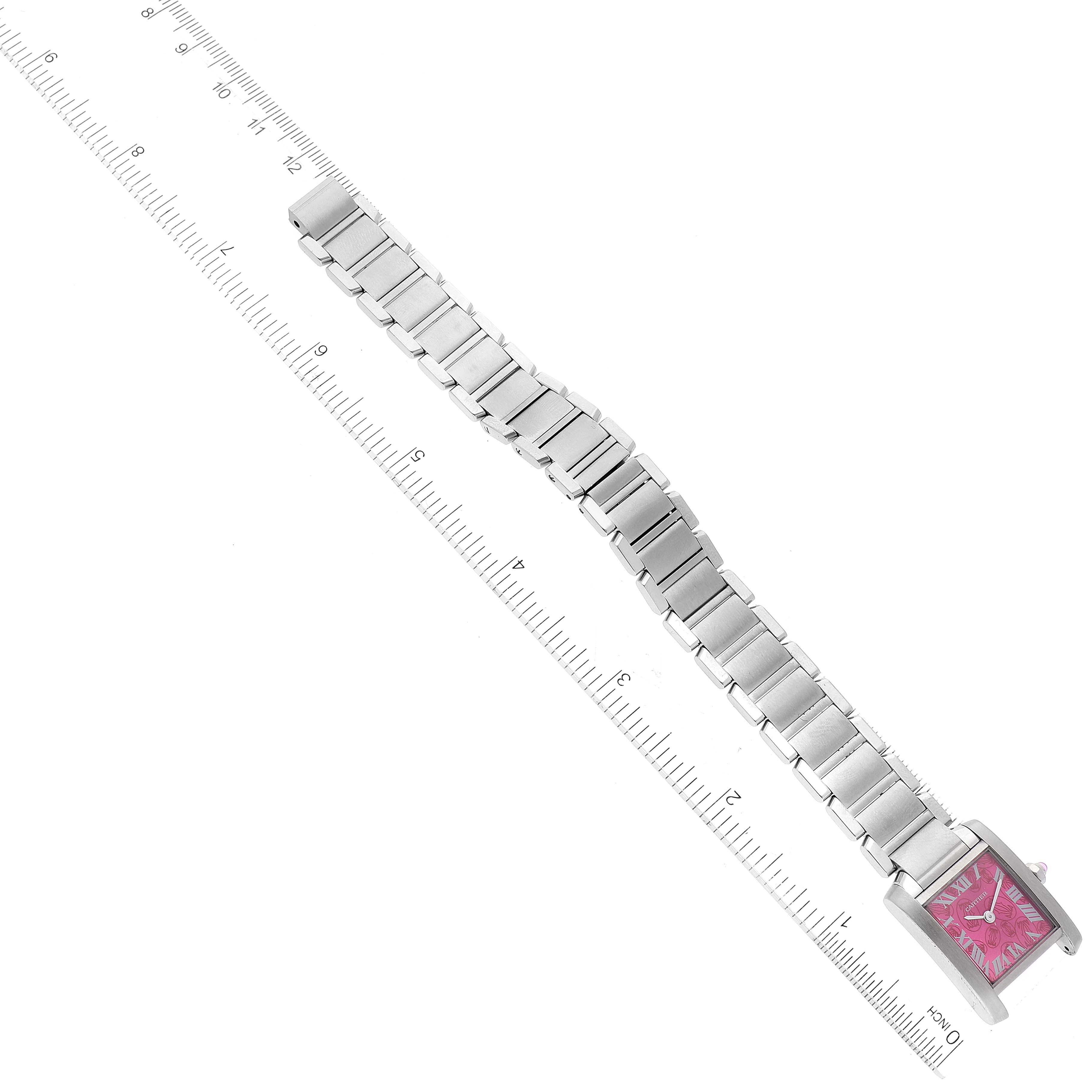 The image shows a Cartier Tank Francaise W51030Q3 Women's Stainless Steel White Dial W51030Q3 Women's Stainless Steel White Dial watch with a pink dial, displayed flat to highlight its metal bracelet against a ruler.
