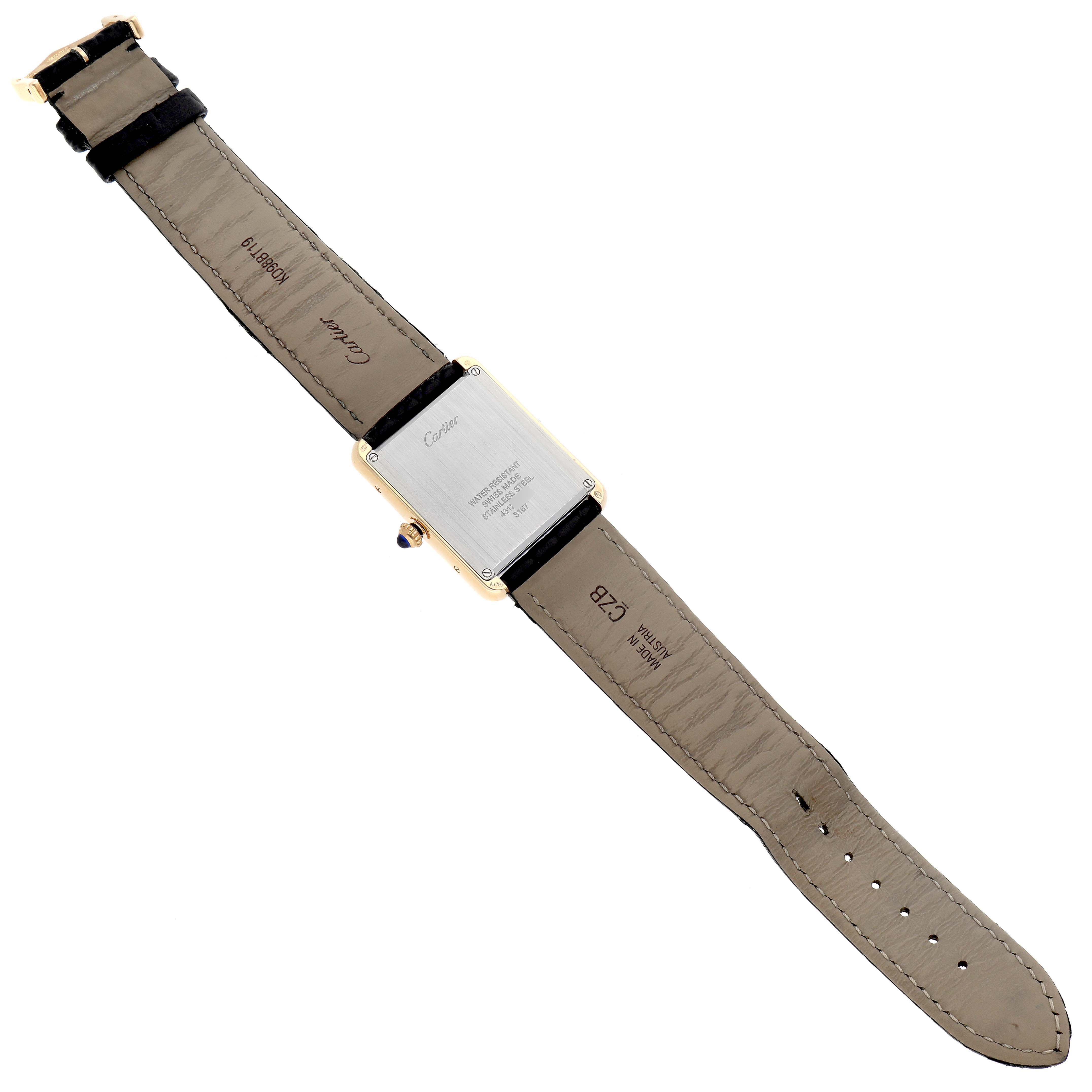 The image shows the back view of a Cartier Tank Solo W5200004 Men's Steel and Gold (two tone) Silver Dial W5200004 Men's Steel and Gold (two tone) Silver Dial watch, displaying its strap, buckle, and case back.