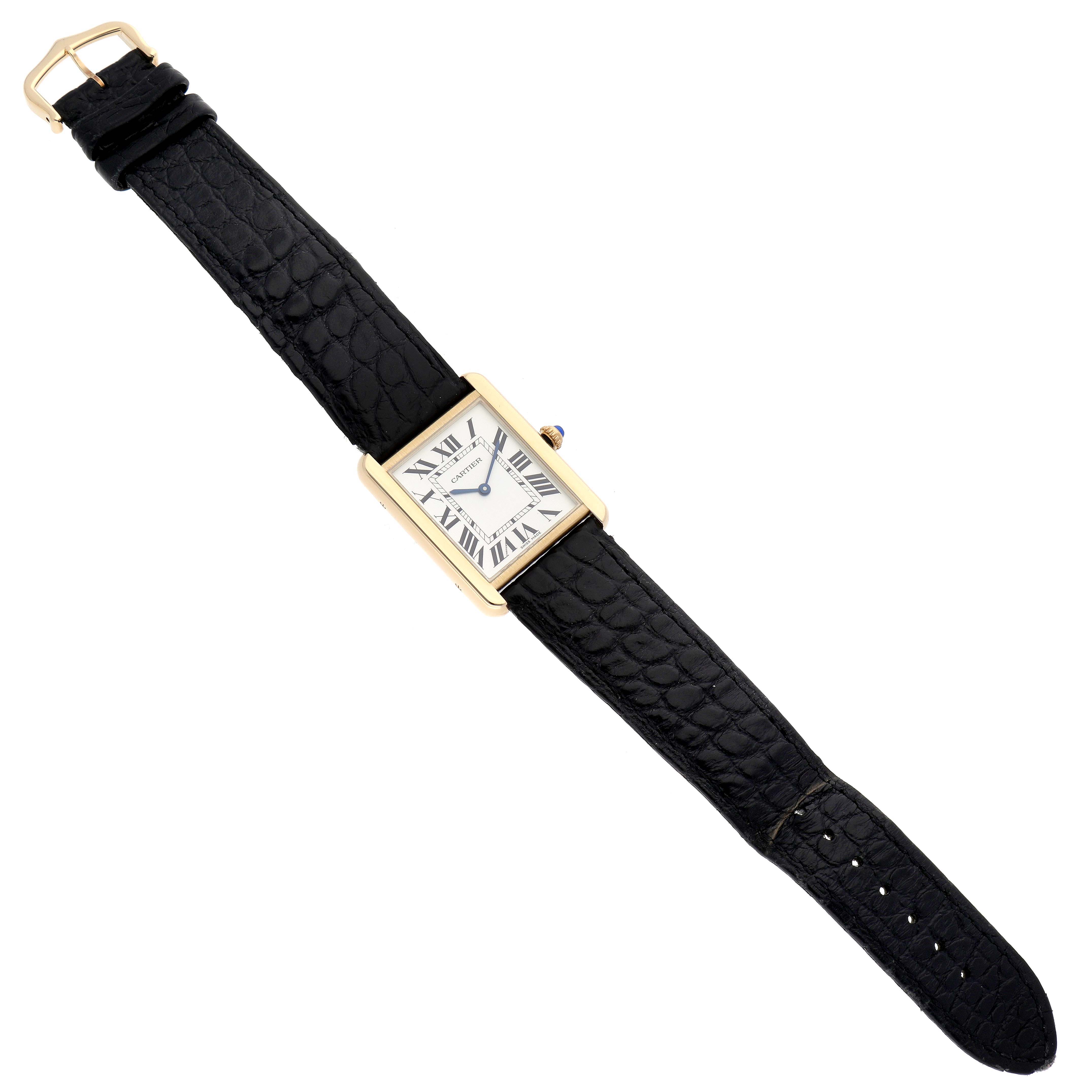 The image shows a Cartier Tank Solo W5200004 Men's Steel and Gold (two tone) Silver Dial W5200004 Men's Steel and Gold (two tone) Silver Dial watch from a top-down angle, displaying the face, case, crown, and whole strap.