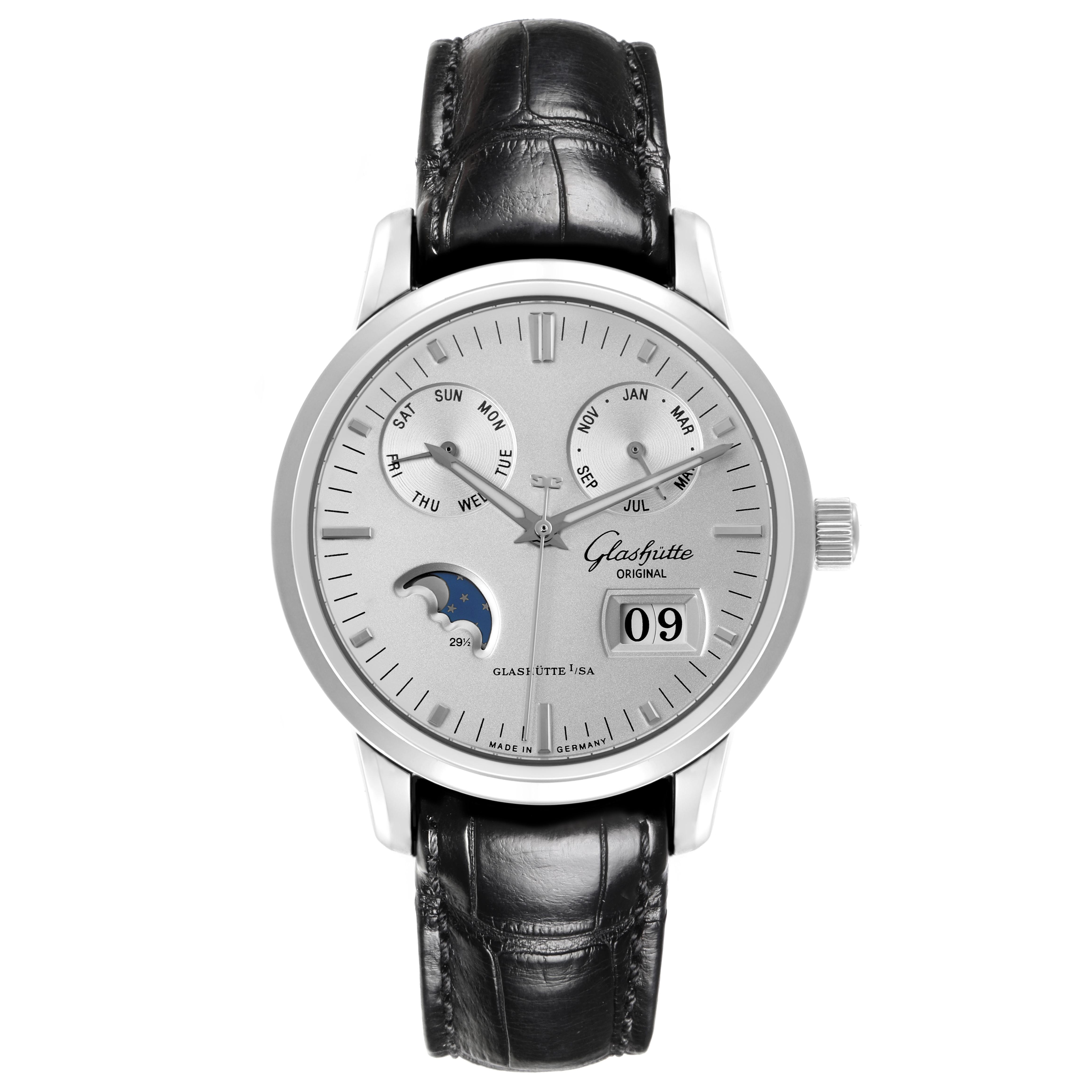 The Glashütte Senator watch is shown from a front angle, displaying the dial, moon phase, date, and leather strap.