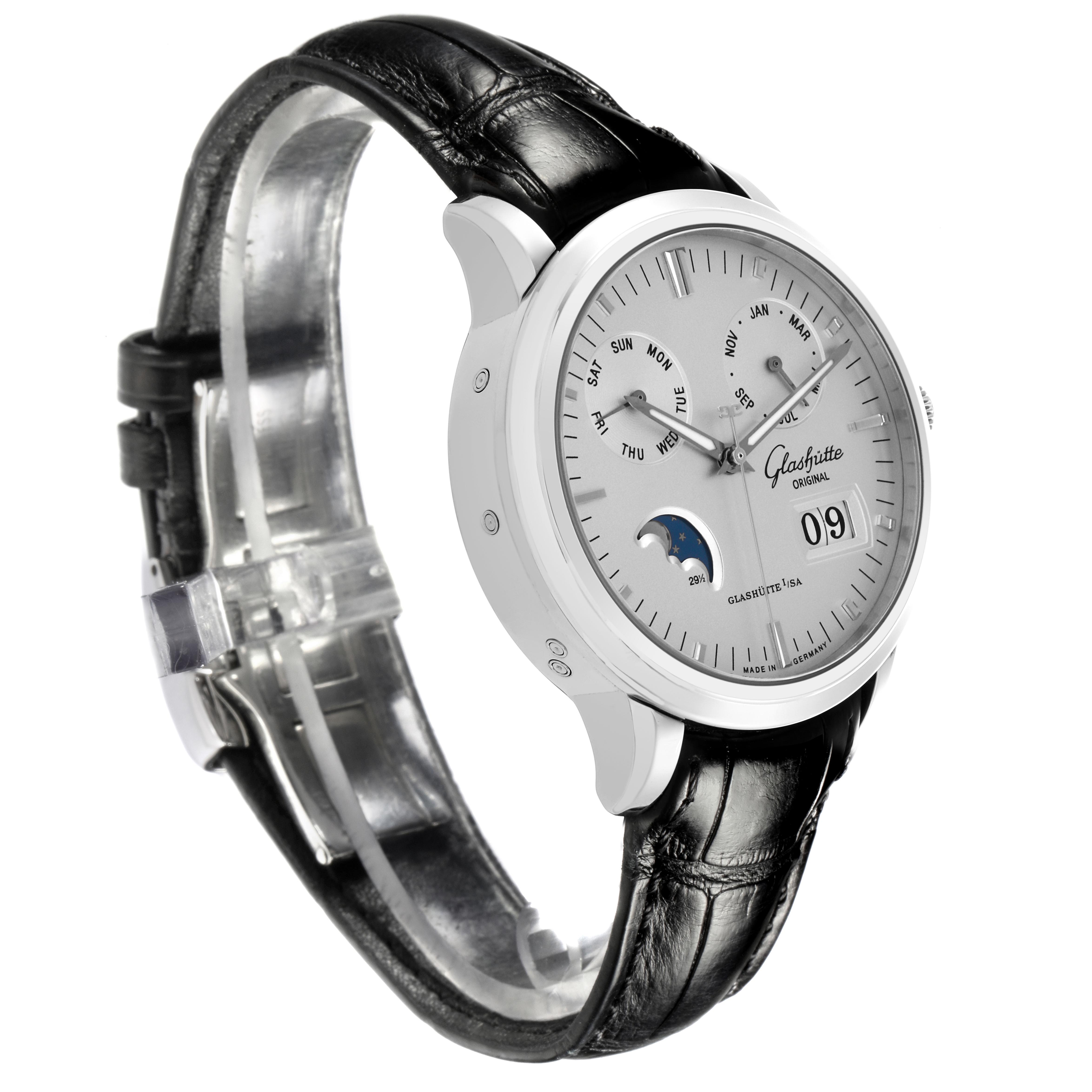 The watch is a Glashutte Senator 100-06-13-02-04 Men's Stainless Steel Silver Dial 100-06-13-02-04 Men's Stainless Steel Silver Dial model, shown at an angle displaying its dial, moonphase, day, month, and strap.