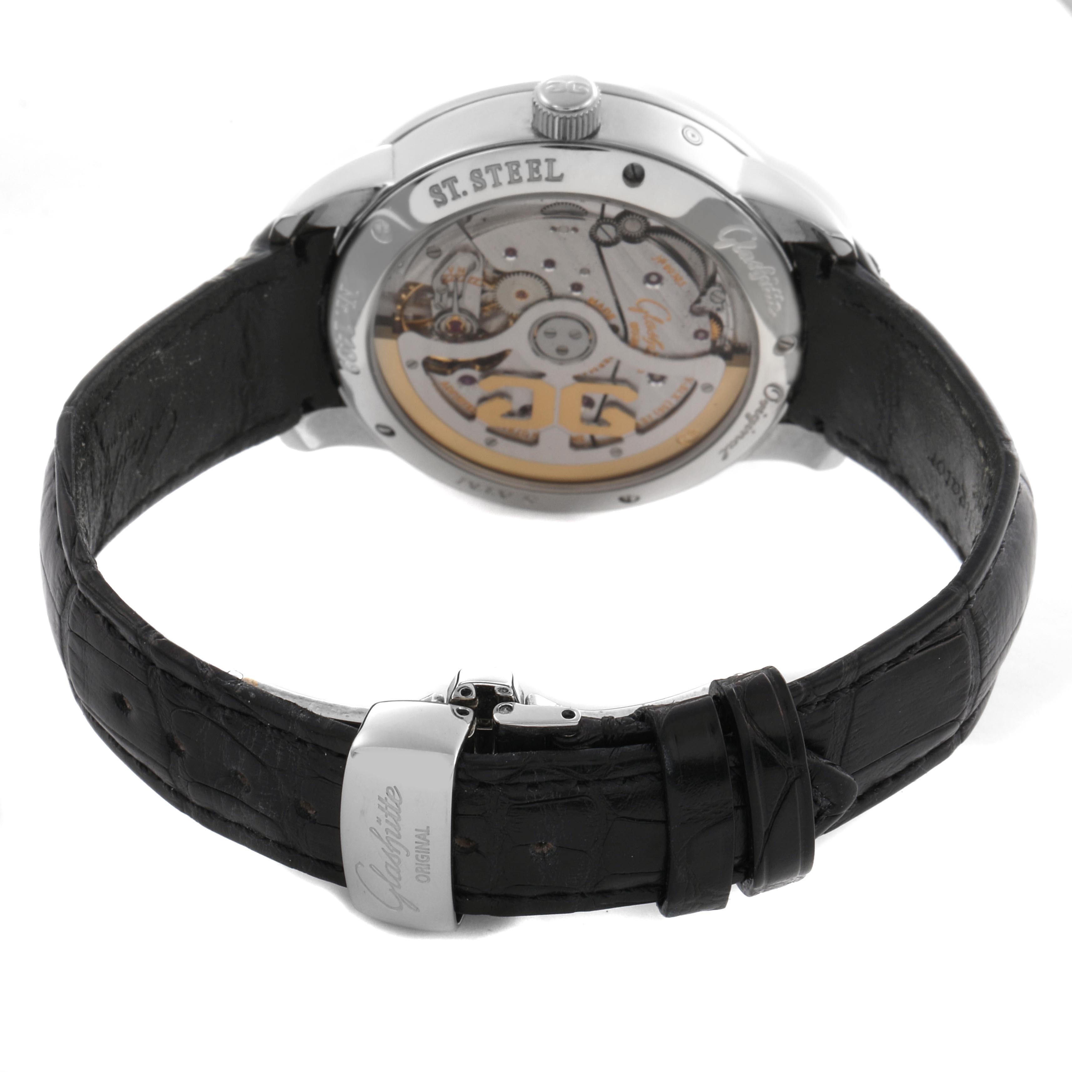 The Glashütte Senator model is shown from the back, highlighting its movement and black leather strap.