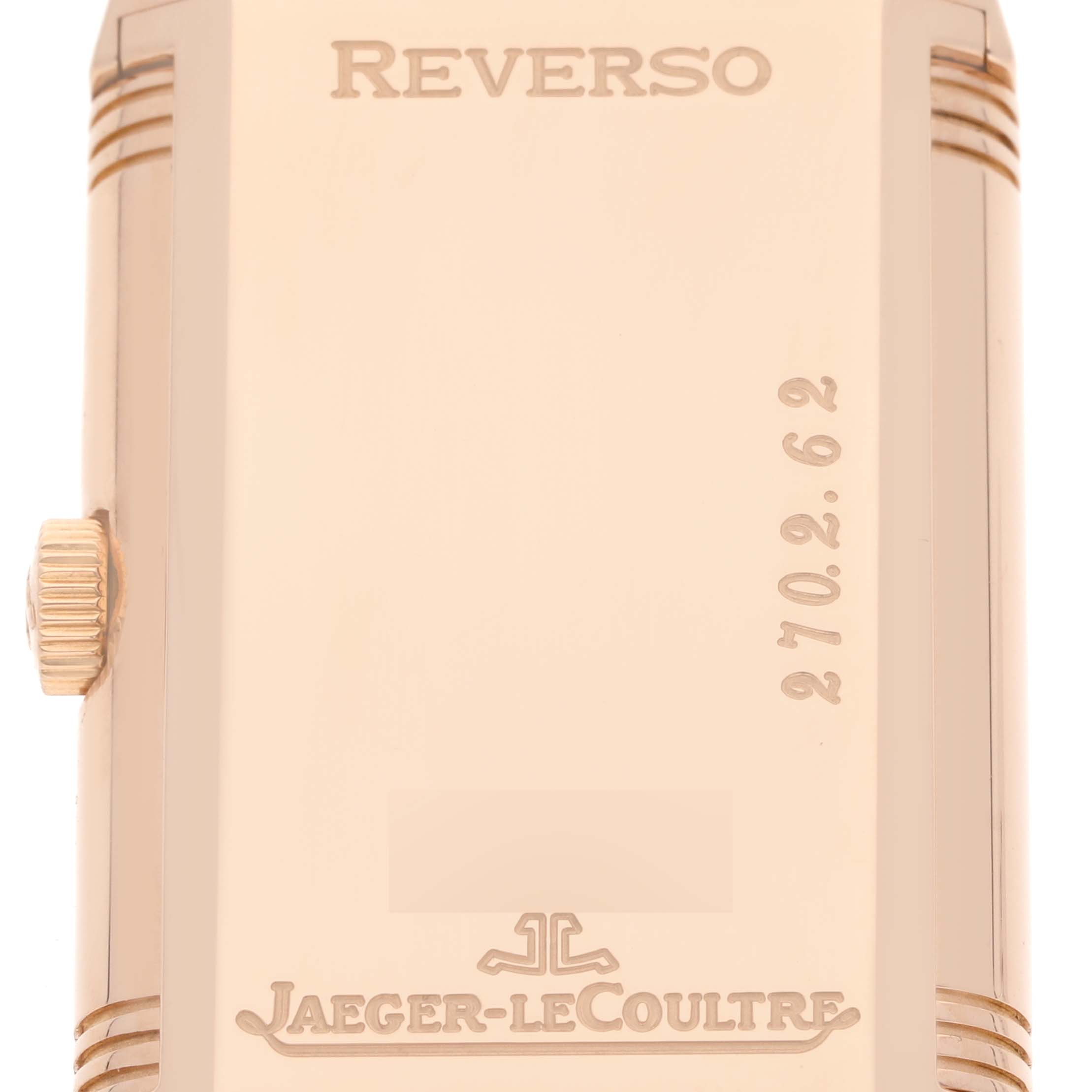 This image shows a close-up view of the back case of a Jaeger LeCoultre Reverso 270.2.62 Men's Rose Gold Silver Dial 270.2.62 Men's Rose Gold Silver Dial watch with brand engravings.