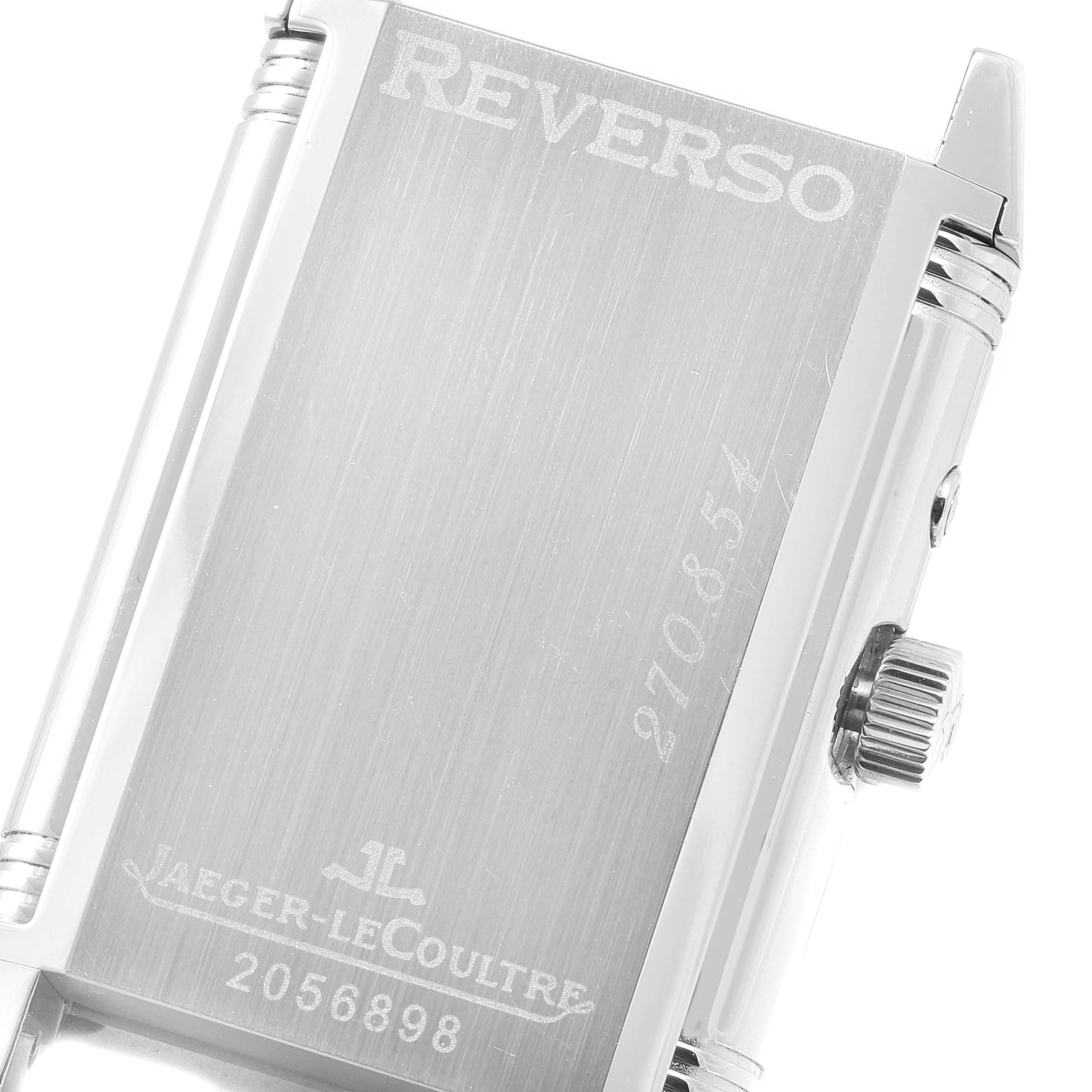 The image shows a close-up of the back and side of a Jaeger-LeCoultre Reverso watch, highlighting the case and crown.