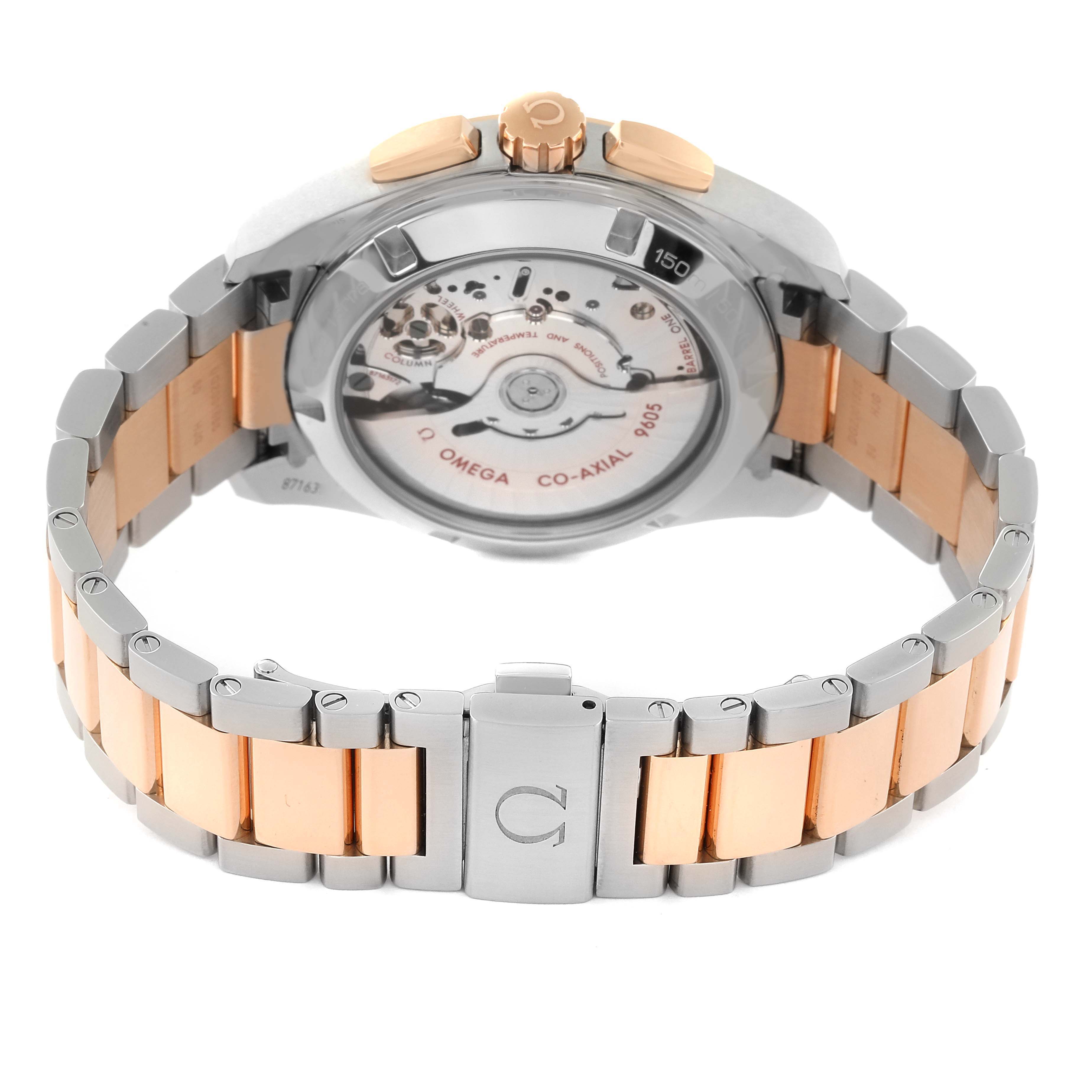 The image shows the back view of an Omega Aqua Terra 231.20.43.52.06.001 Men
s Steel and Gold (two tone) Grey Dial 231.20.43.52.06.001 Men
s Steel and Gold (two tone) Grey Dial watch, highlighting its movement and two-tone bracelet.